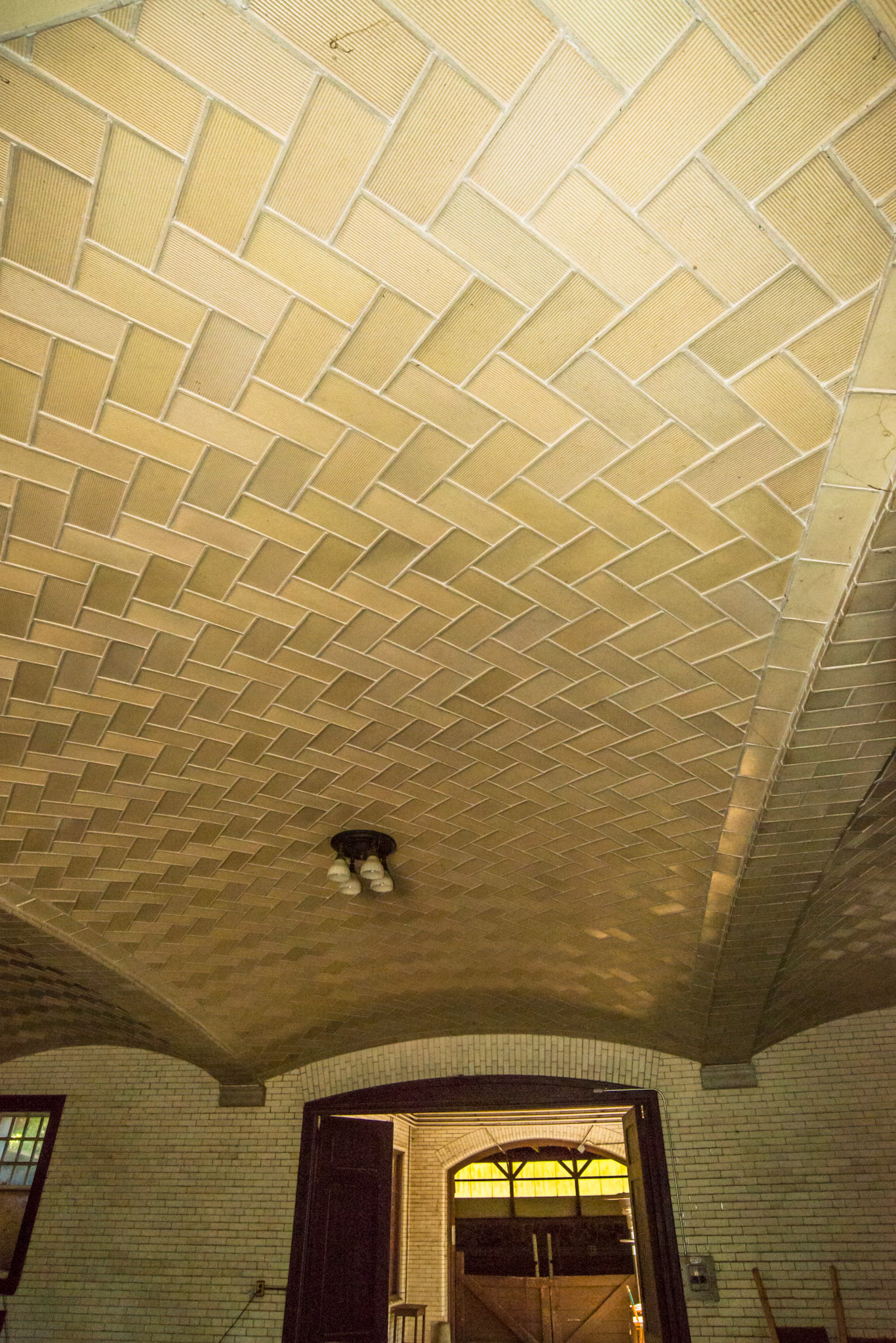 Vaulted ceilings like Grand Central Station in NY City. My voice reflected down in an echo when speaking directly underneath. Note the texture of the tiles. A famous barn in CT that was built in the 1940's by the same archetect used in the building of Grand Central Station in NYC.