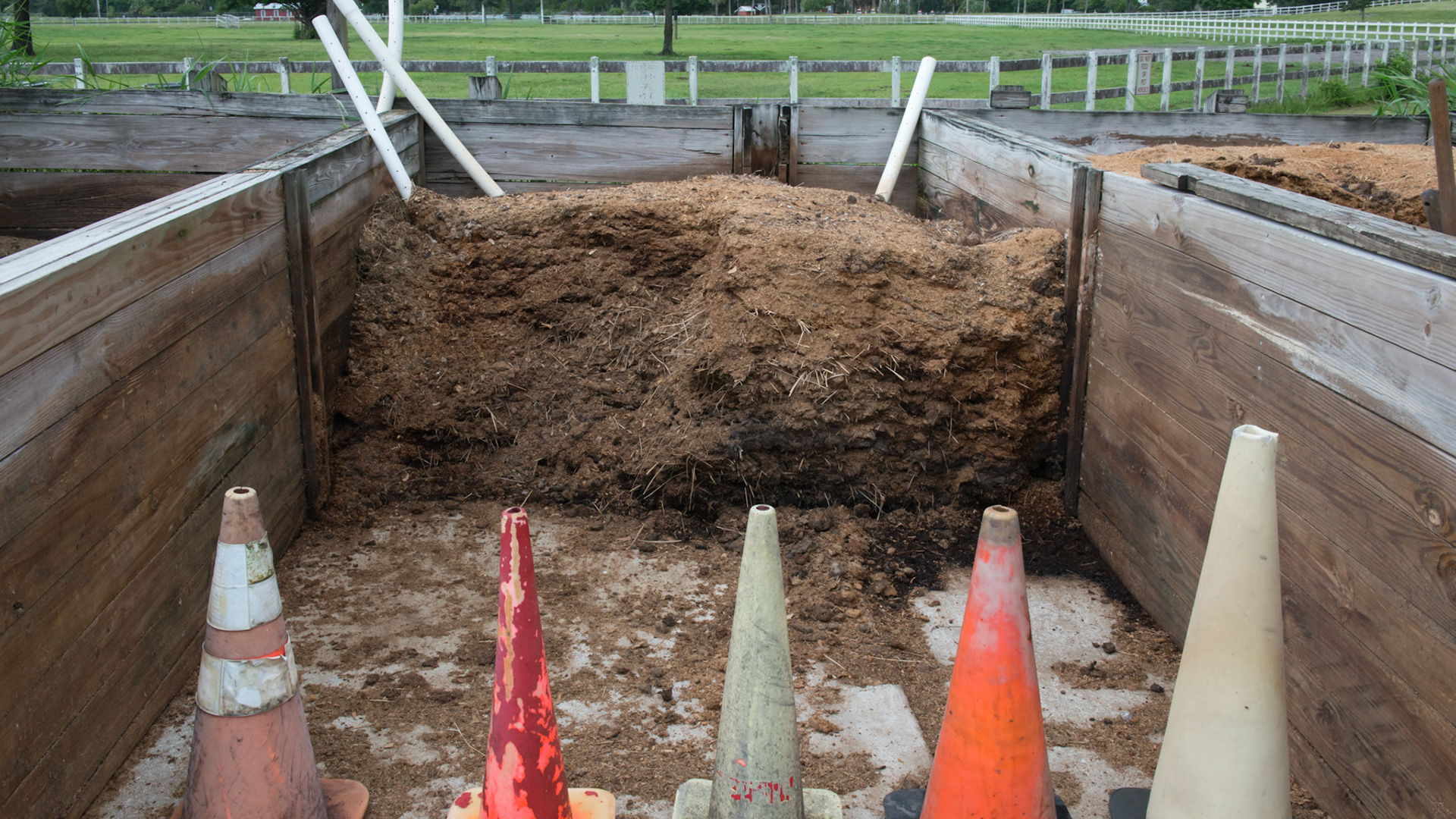 3 bins for manure composting. Air tubes plus daily watering and turning the top layers. 2 months later it is spread on a unused paddock and allowed to set for 1 month. 3 of 4