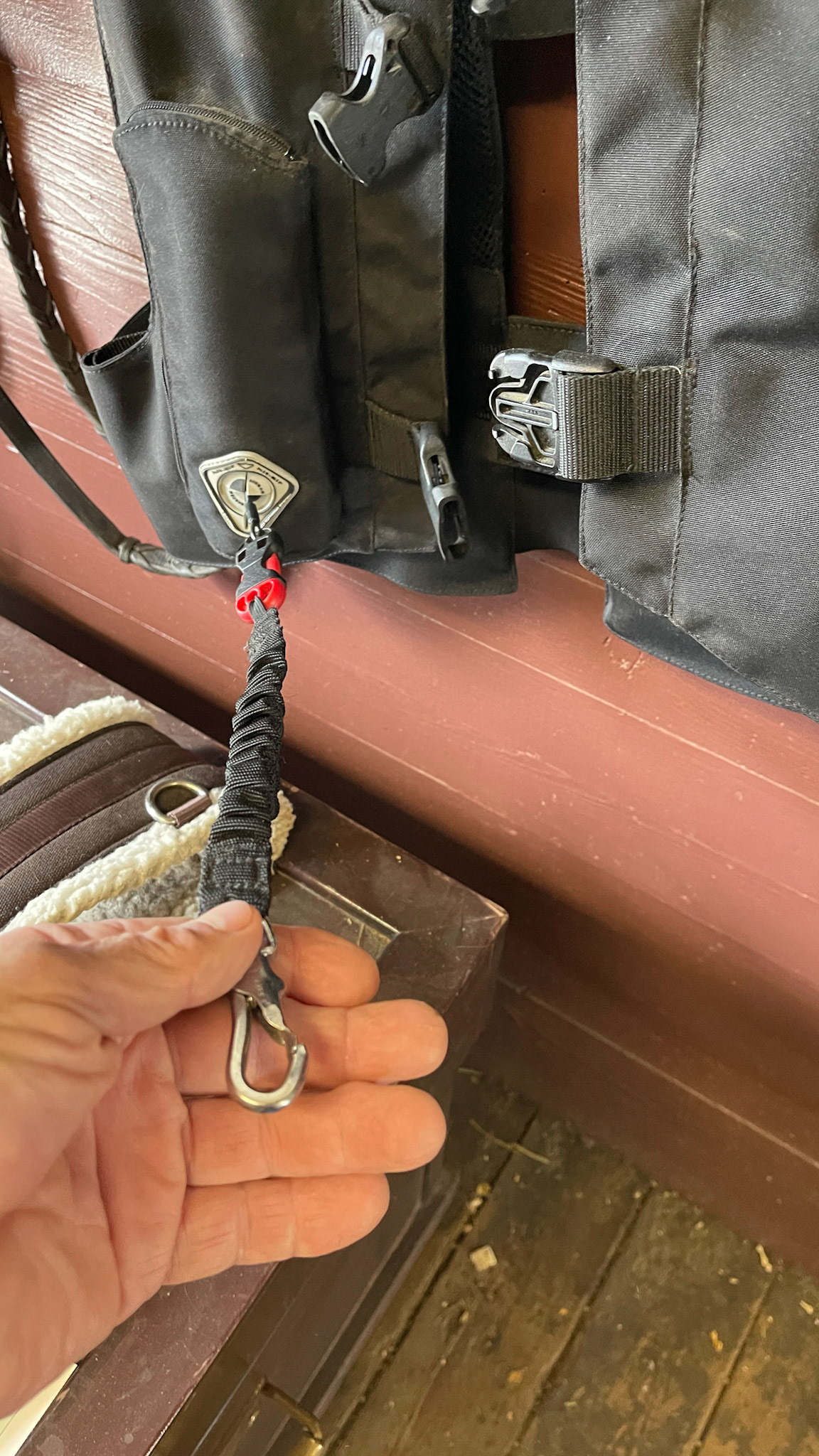 Inflatable safety riding vest. Lanyard attaches to the horse and activates a CO2 tank for instant inflation.