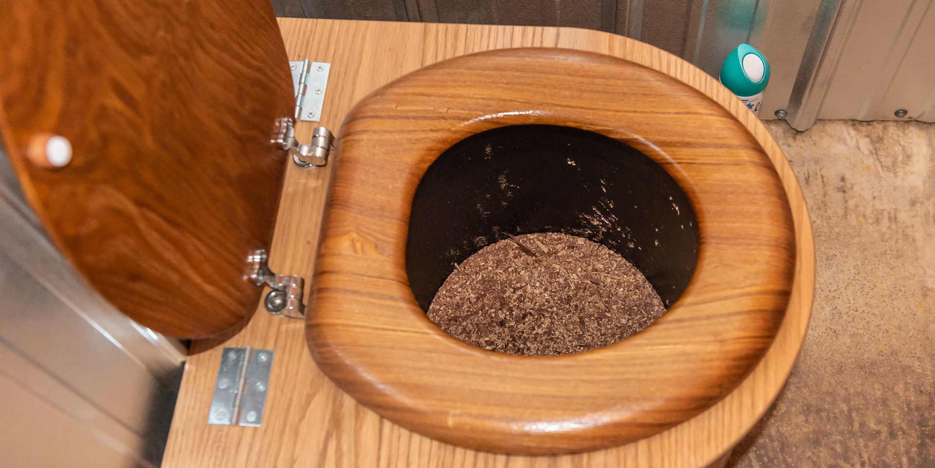 A sawdust toilet in a barn. There is a 5 gallon pail with sawdust or shavings under the seat.  See the picture with the directions for use.  Very simple and works where there is no plumbing. Owner says there is no smell and is easy to use.