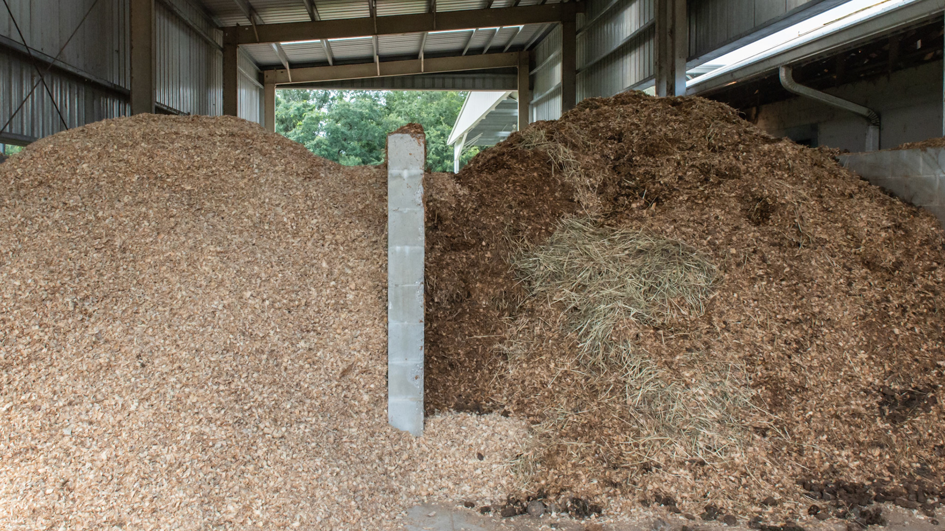 Covered bay for shavings and waste storage. 3 of 3