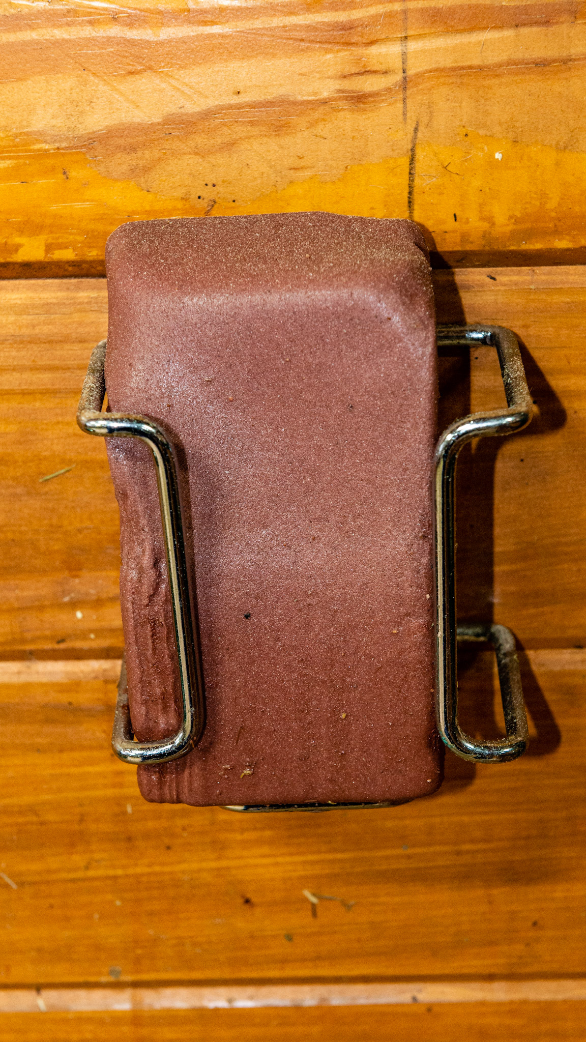 A trace mineral salt lick in a stainless steel salt holder