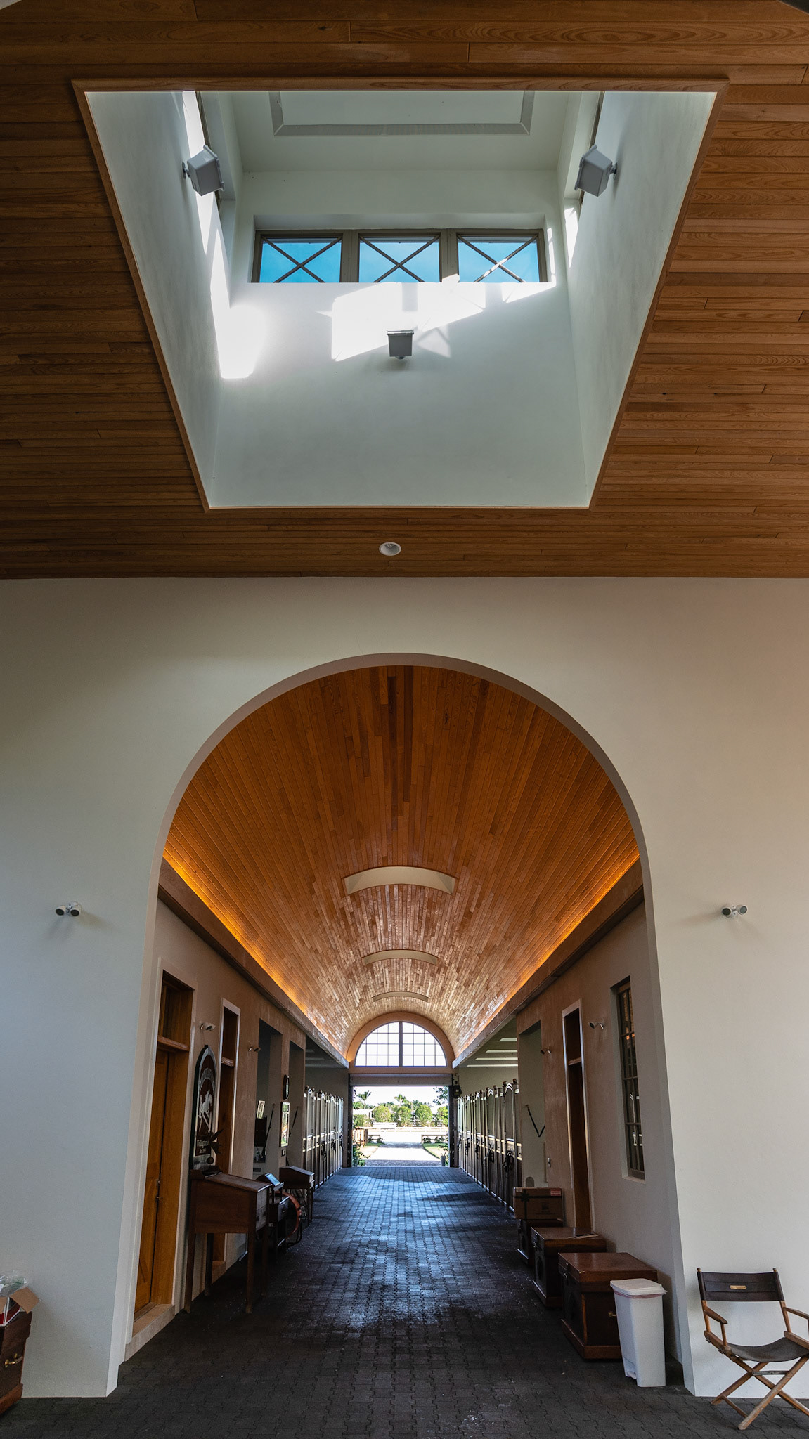 Recessed lights along the ceiling just above the stalls, plus a skylight