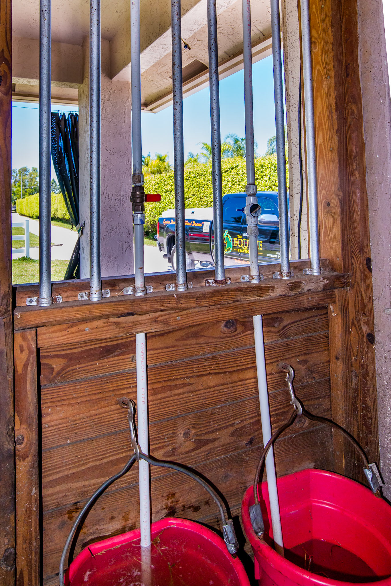 Water filing pipes integrated into stall bars.