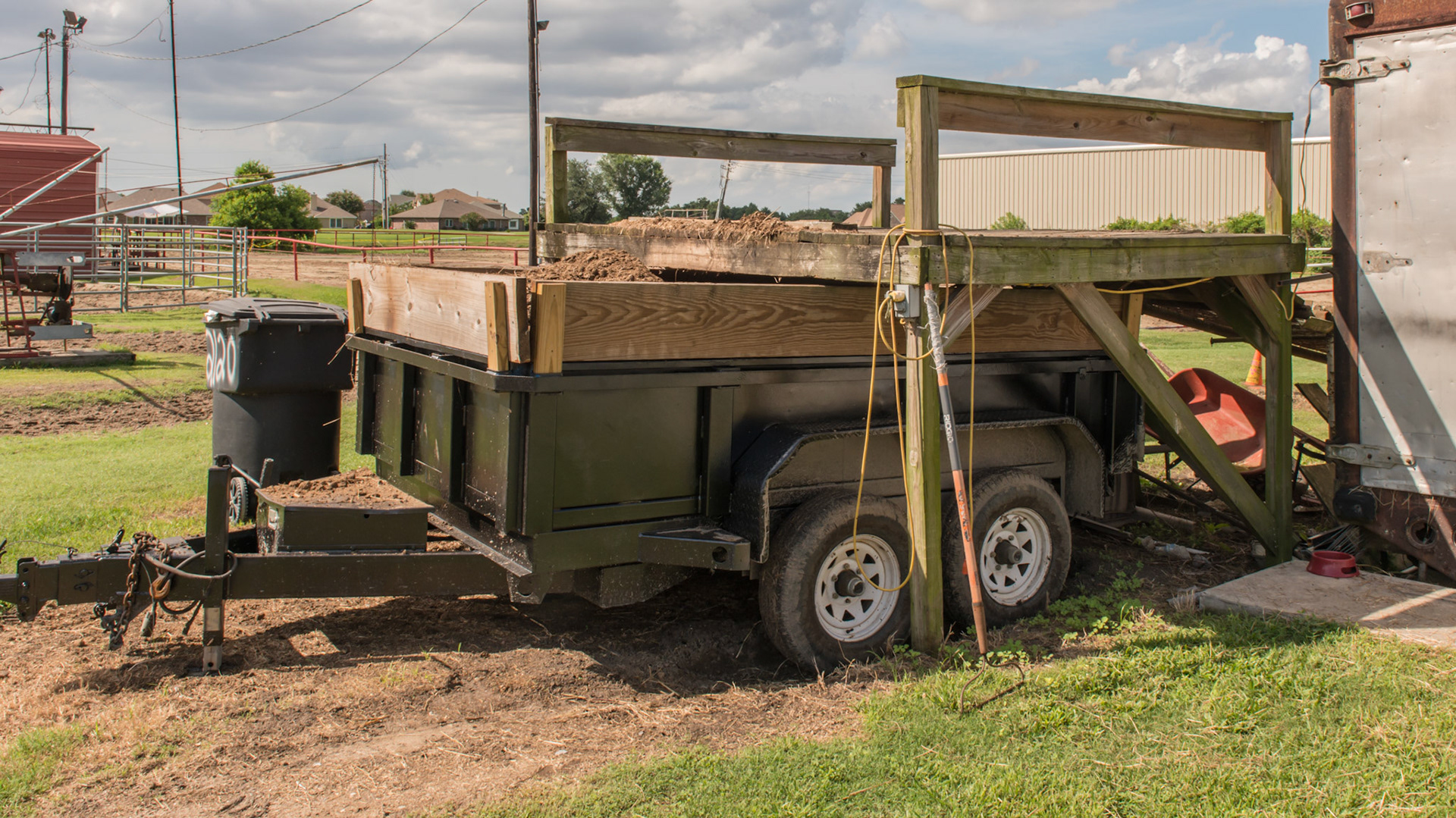 Manure dumping platform allows for above dumping into a dump wagon.  After the front is filled, the wagon is moved forward for filling the back.