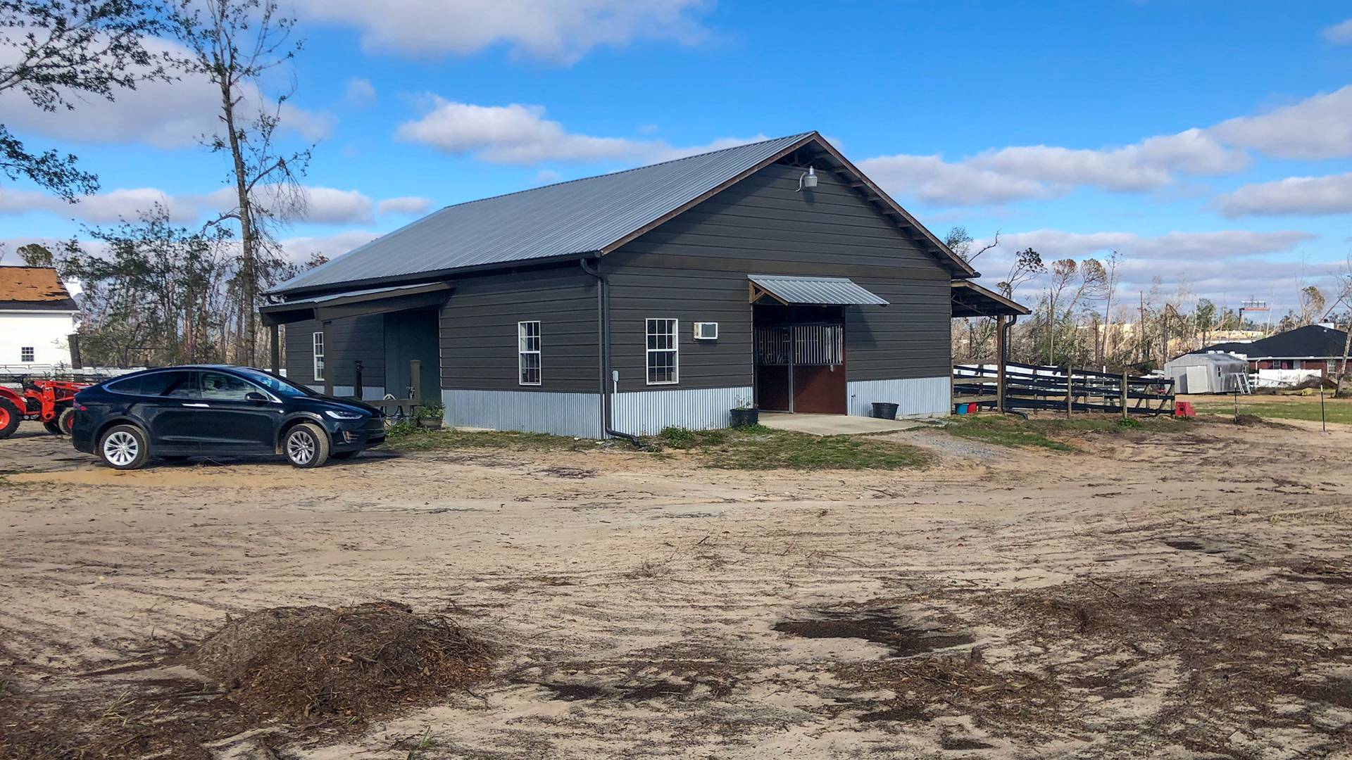 AFTER: This barn in Panama City, FL was hit by a severe hurricane.  See the trees in the before pictures and the wasteland missing trees and wide open spaces which were once wooded lands.  Amazingly, the barn was untouched.