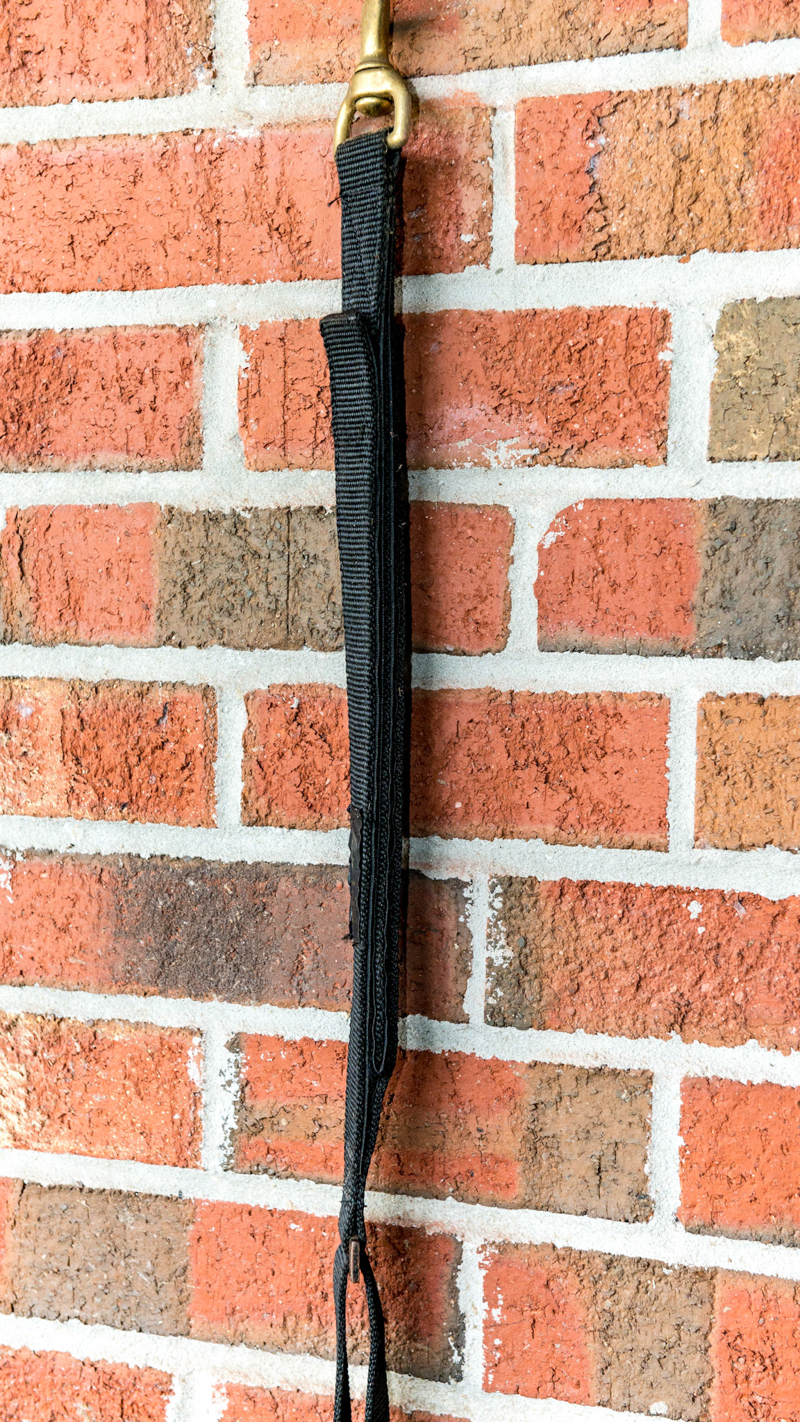 Cross tie using velcro as the break away mechanism.