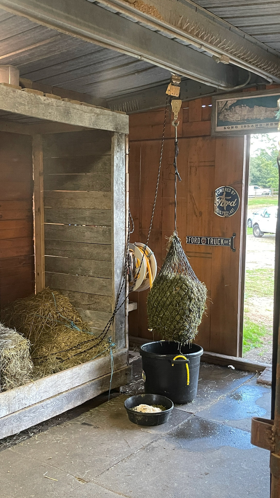 A rope winch system for raising and draining soaked hay.