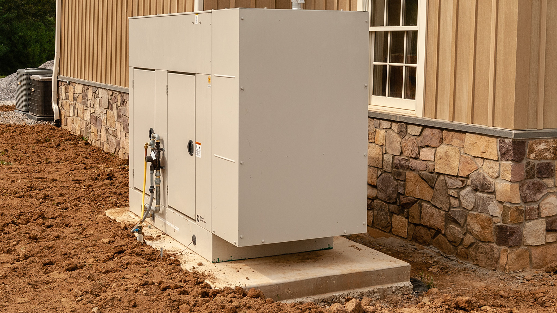 Permanent back up generator outside a barn.