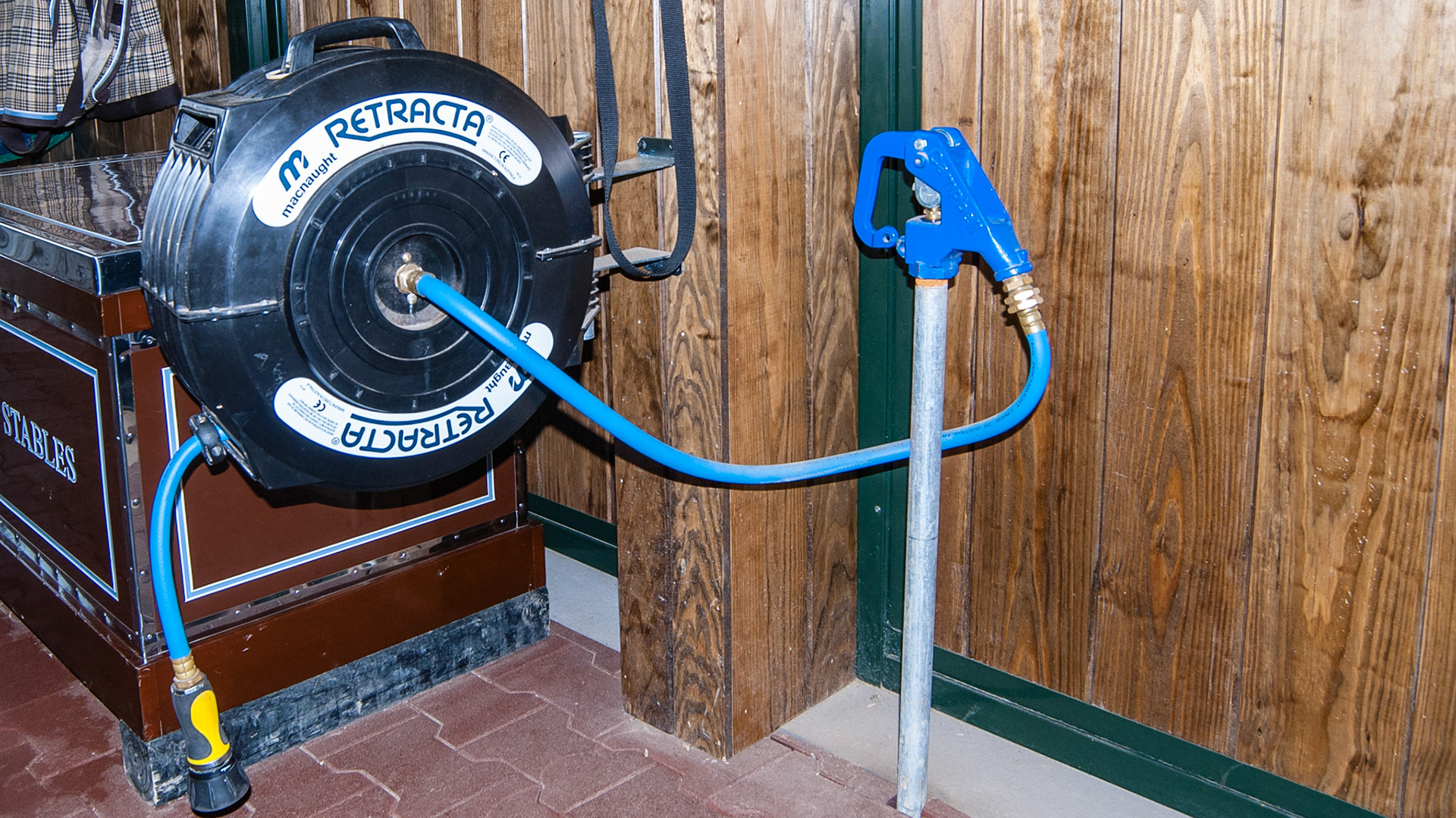 Hydrant with an industrial hose coiler