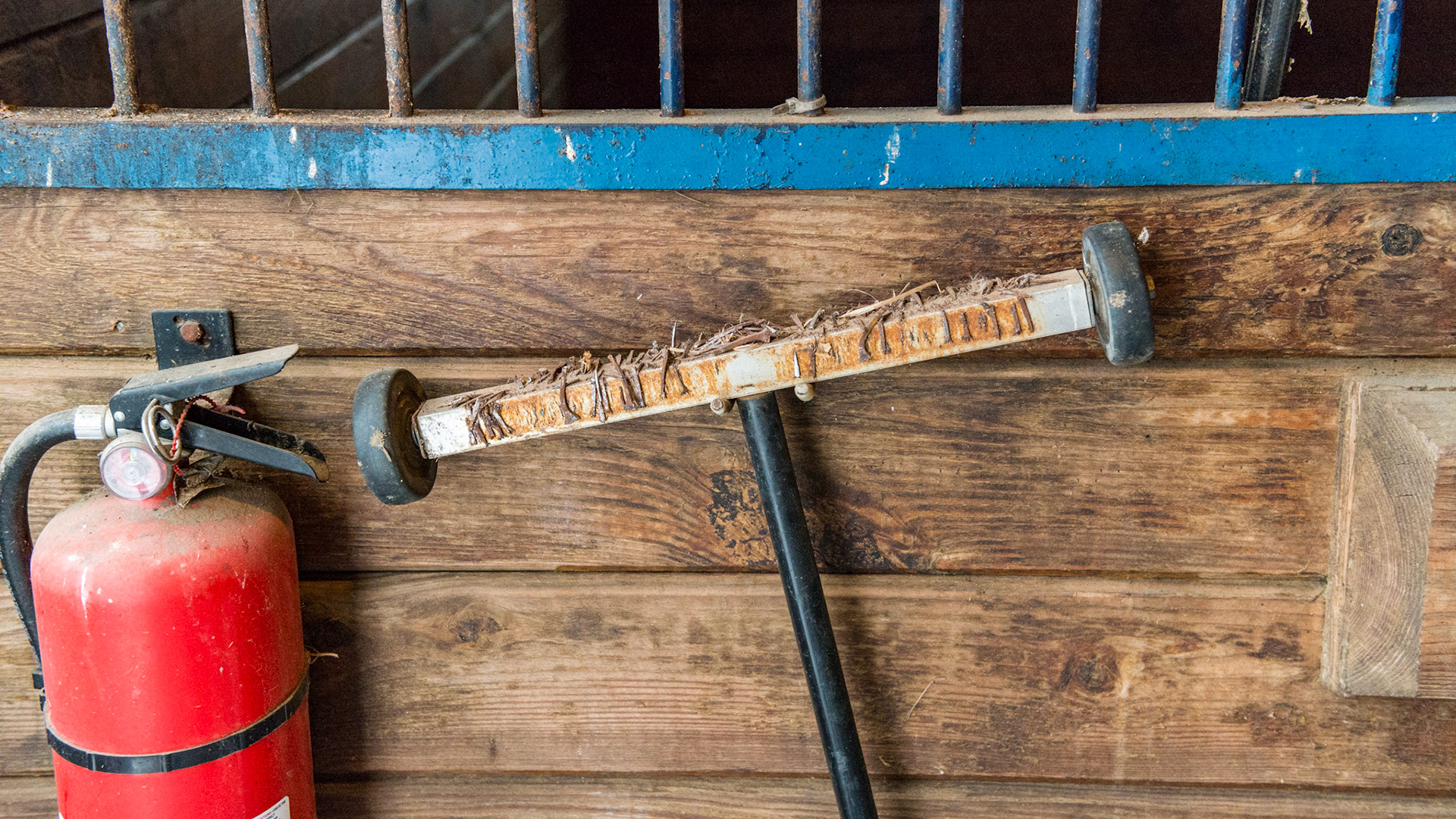 A magnetic bar on rollers helps pick up the nails around the farrier's work area.