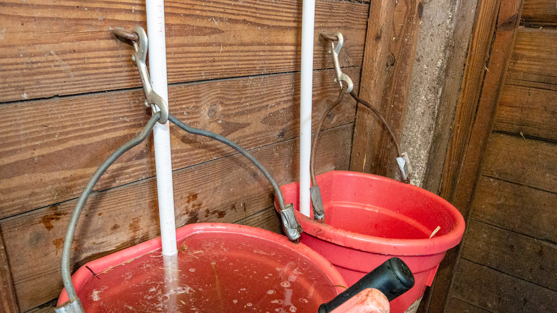 Buckets hung correctly and ends taped. Filling pipe extend to the bottom of the buckets.