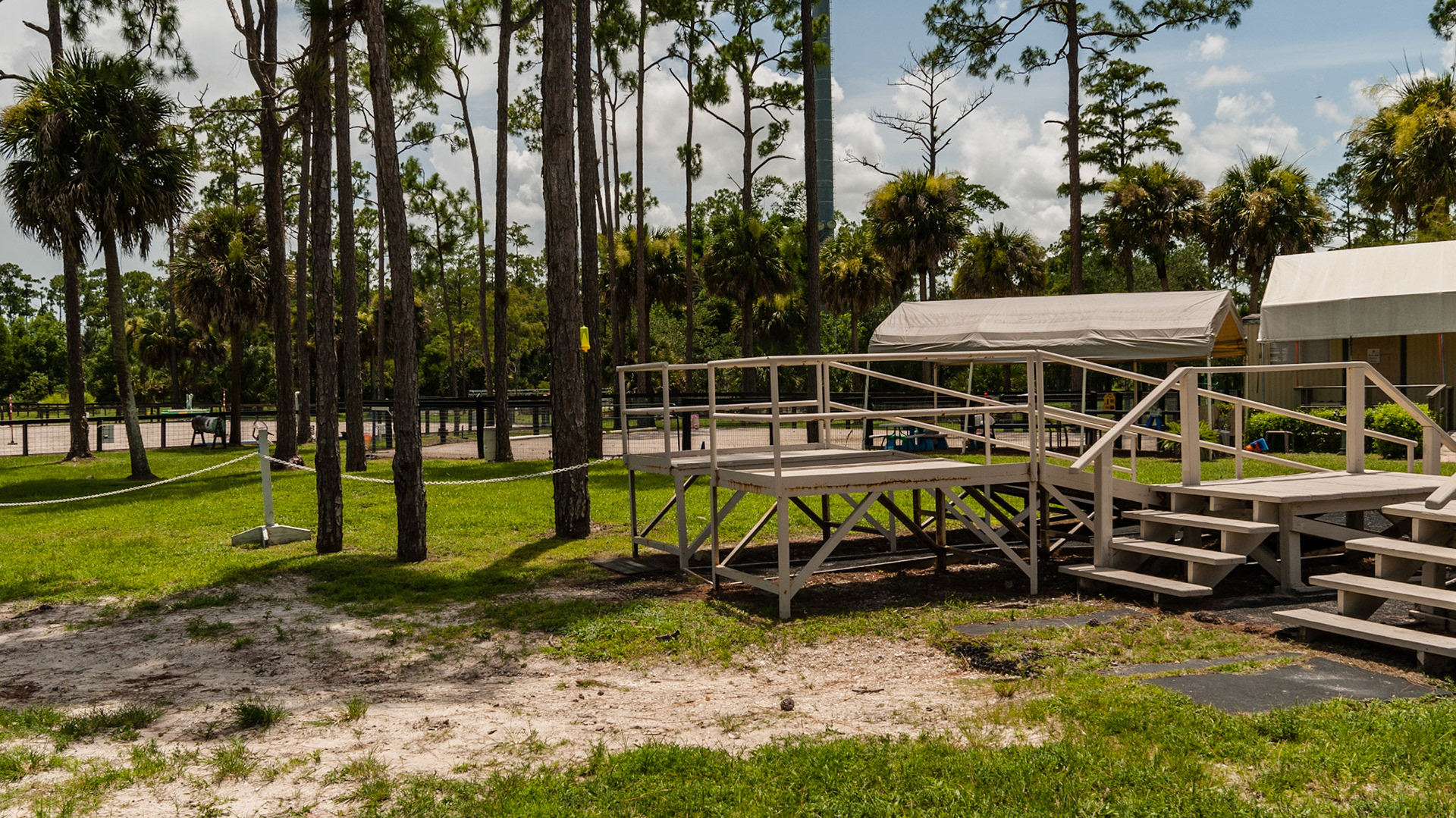 The horse walks between these loading ramps where a rider and assistants accomplish mounting.