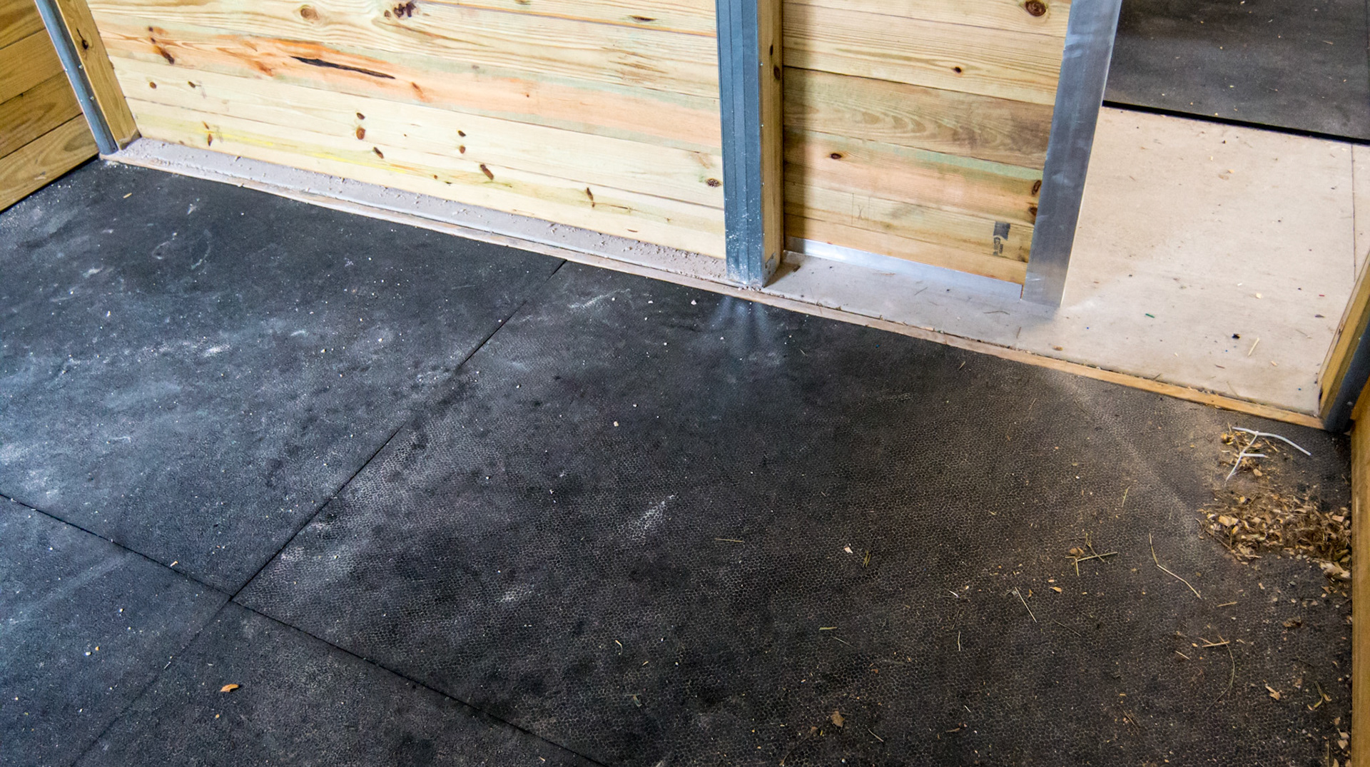 Metal trim in a brand new barn in Loxahatchee, FL - poured concrete and inlaid rubber stall mats