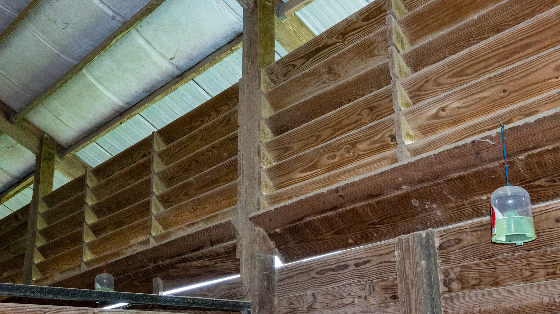 Ventilation headers in a south FL barn - angled so the hot sun rays cannot get in.