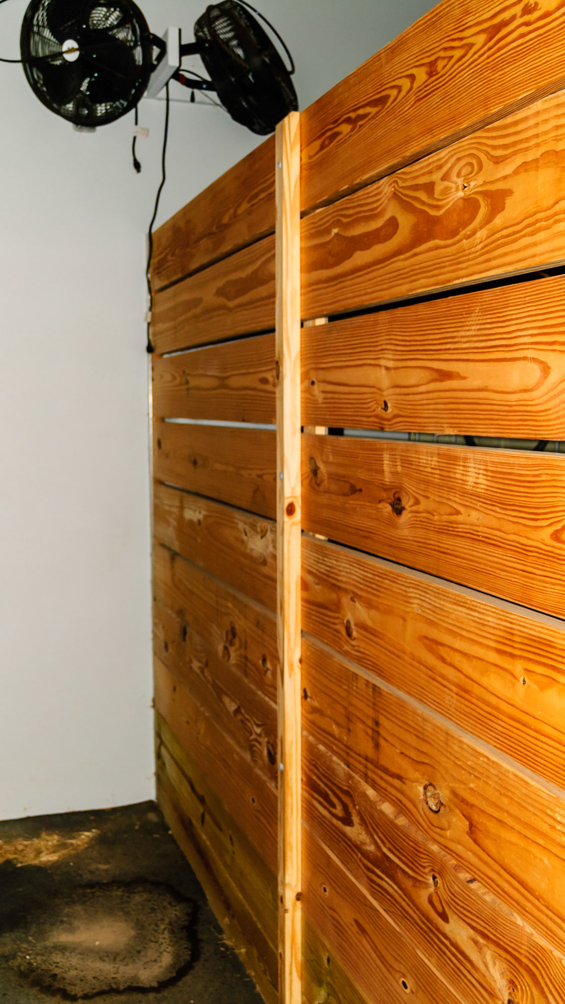 A simple 2x4 applied with stove bolts.  Note the beveled edges, the ventilation slats and looking through the openings, the opposing board - hence the name sandwich boards.