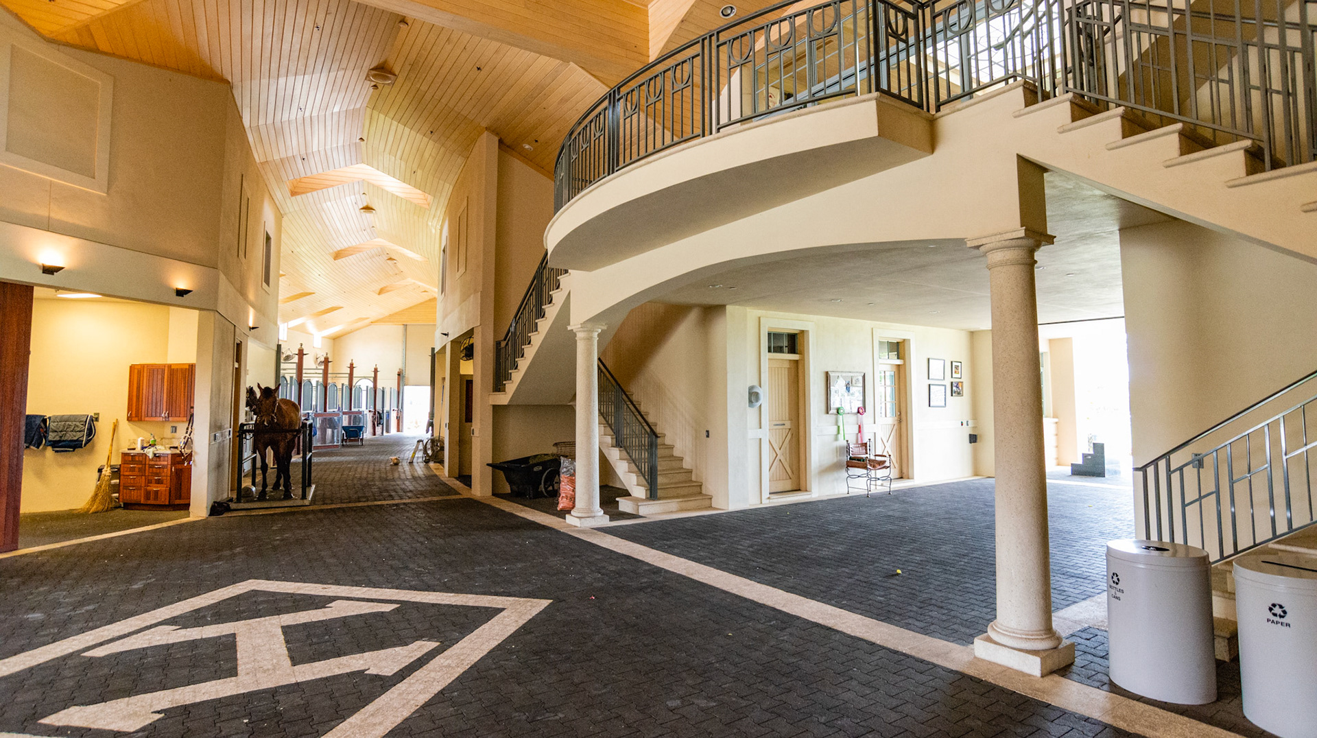 Rubber brick flooring and a finished stained wood ceiling.