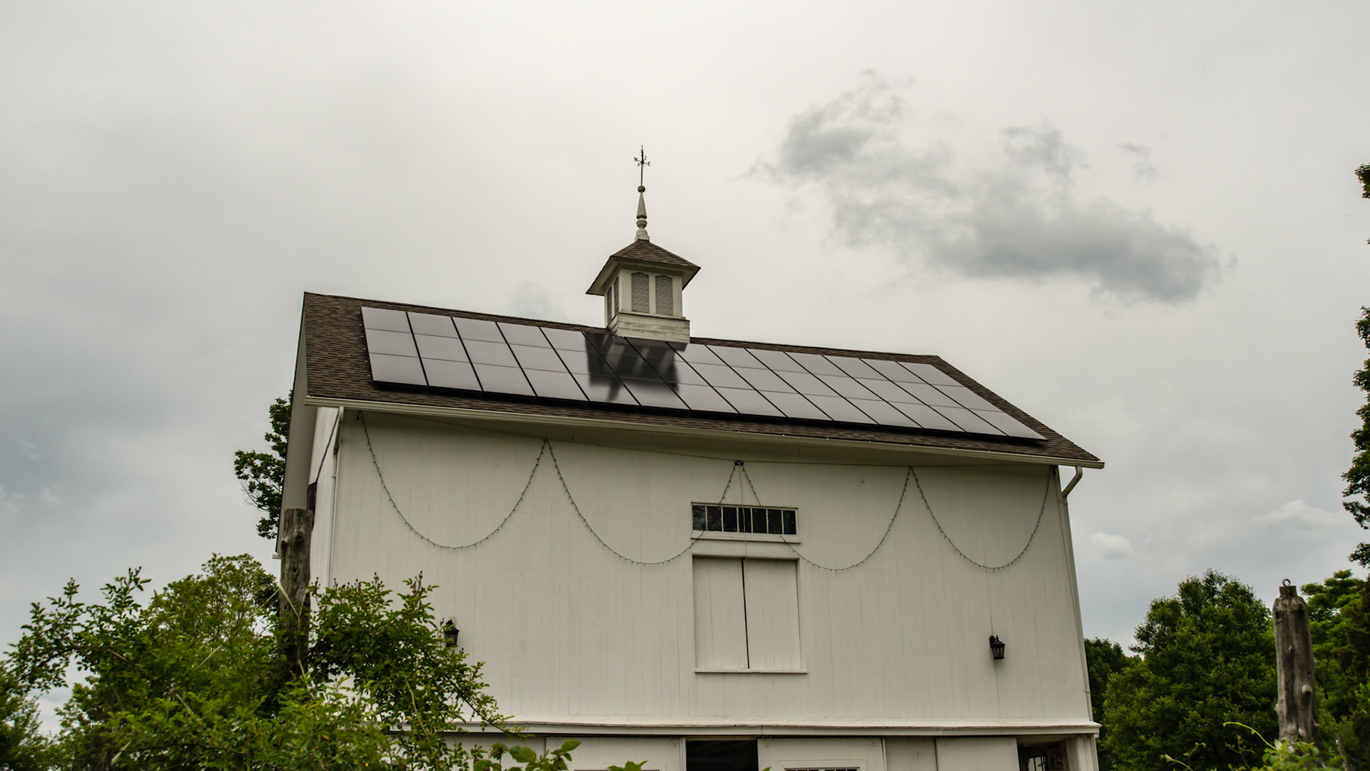 Owner in NY says these solar panels produce more electricity than he uses in summer, but in winter, he spends $15 / mo on electricity.