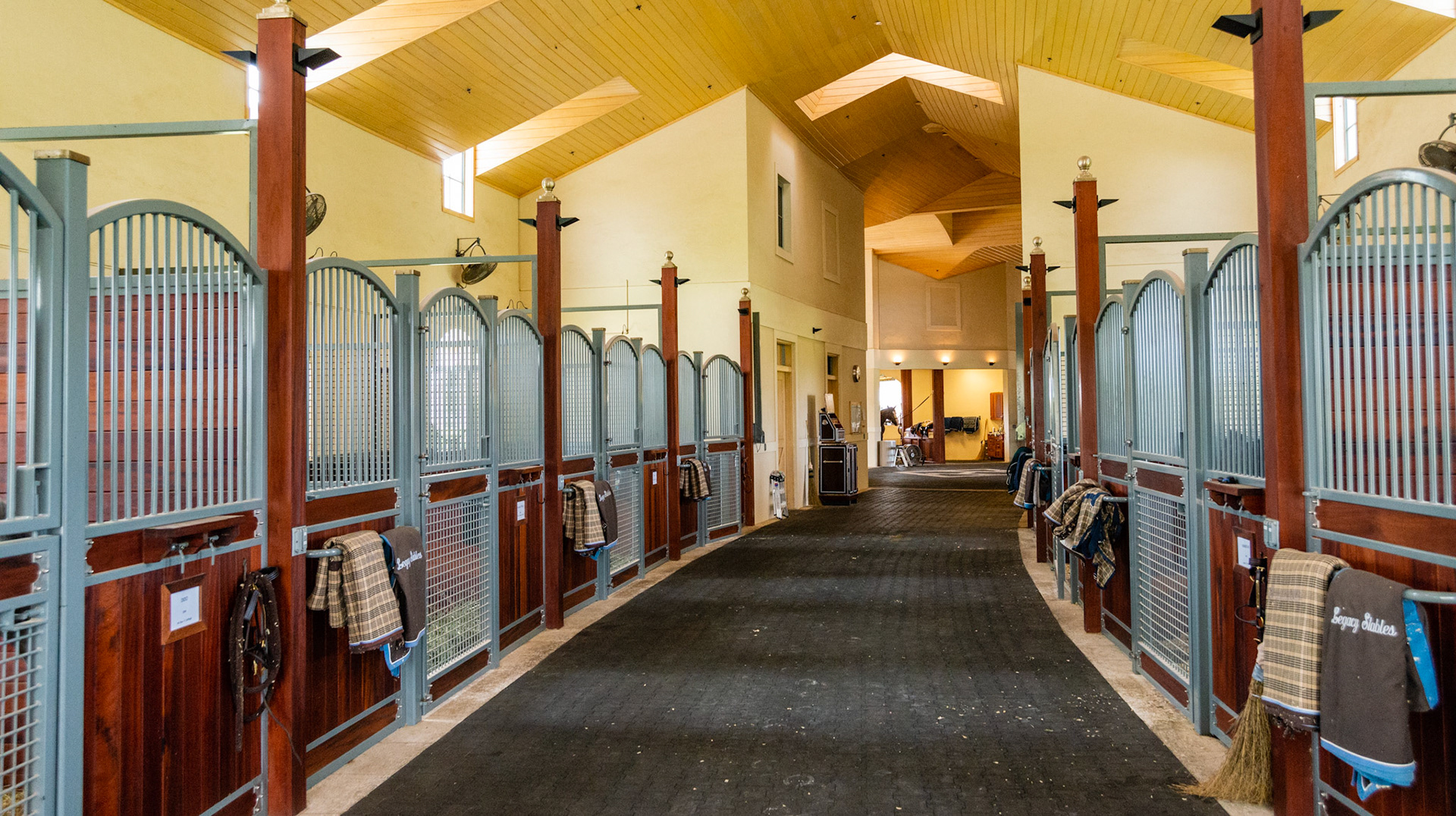 Rubber brick flooring and a finished stained wood ceiling.