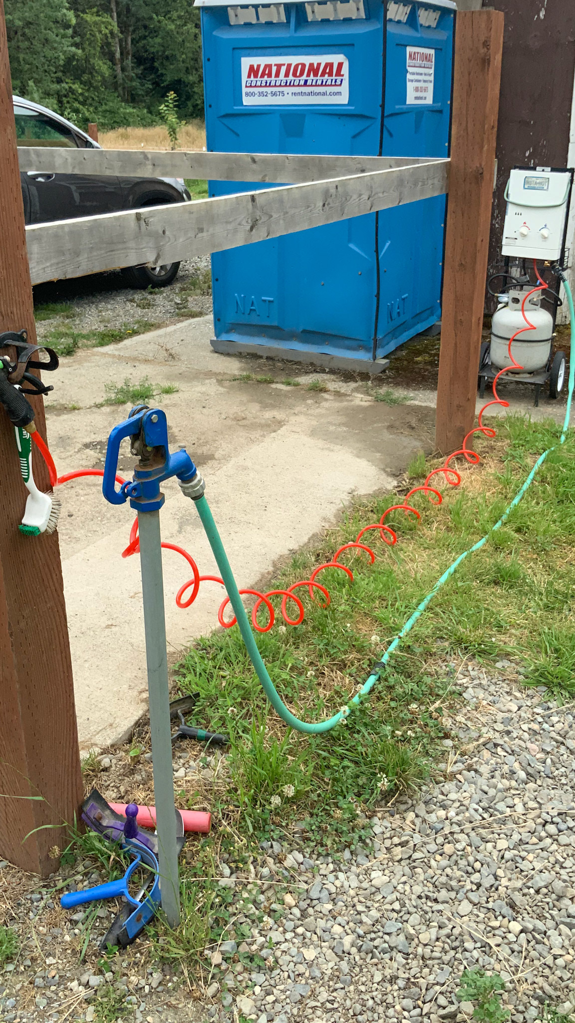 This is a propane driven instant hot water system next to the wash area.  The system is taken down during winter due to freezing of the lines.