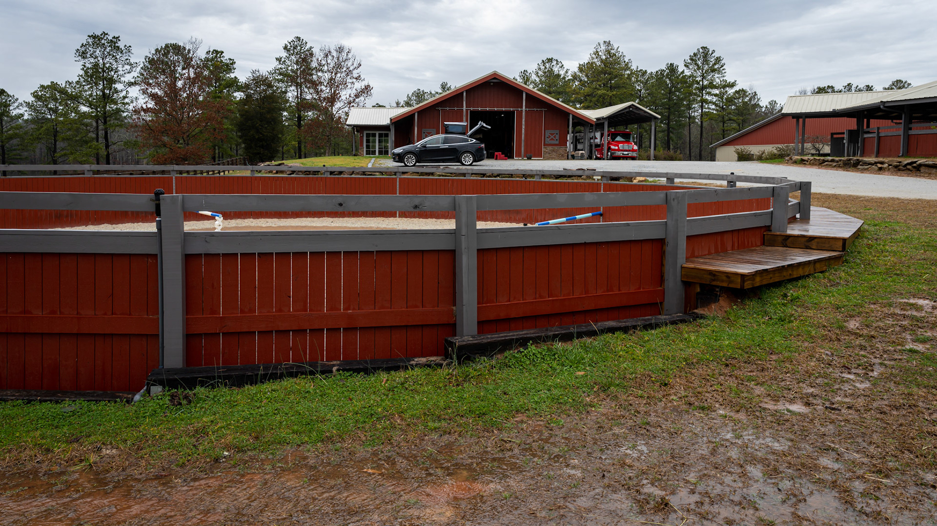 Various views of a round pen built into a hillside.