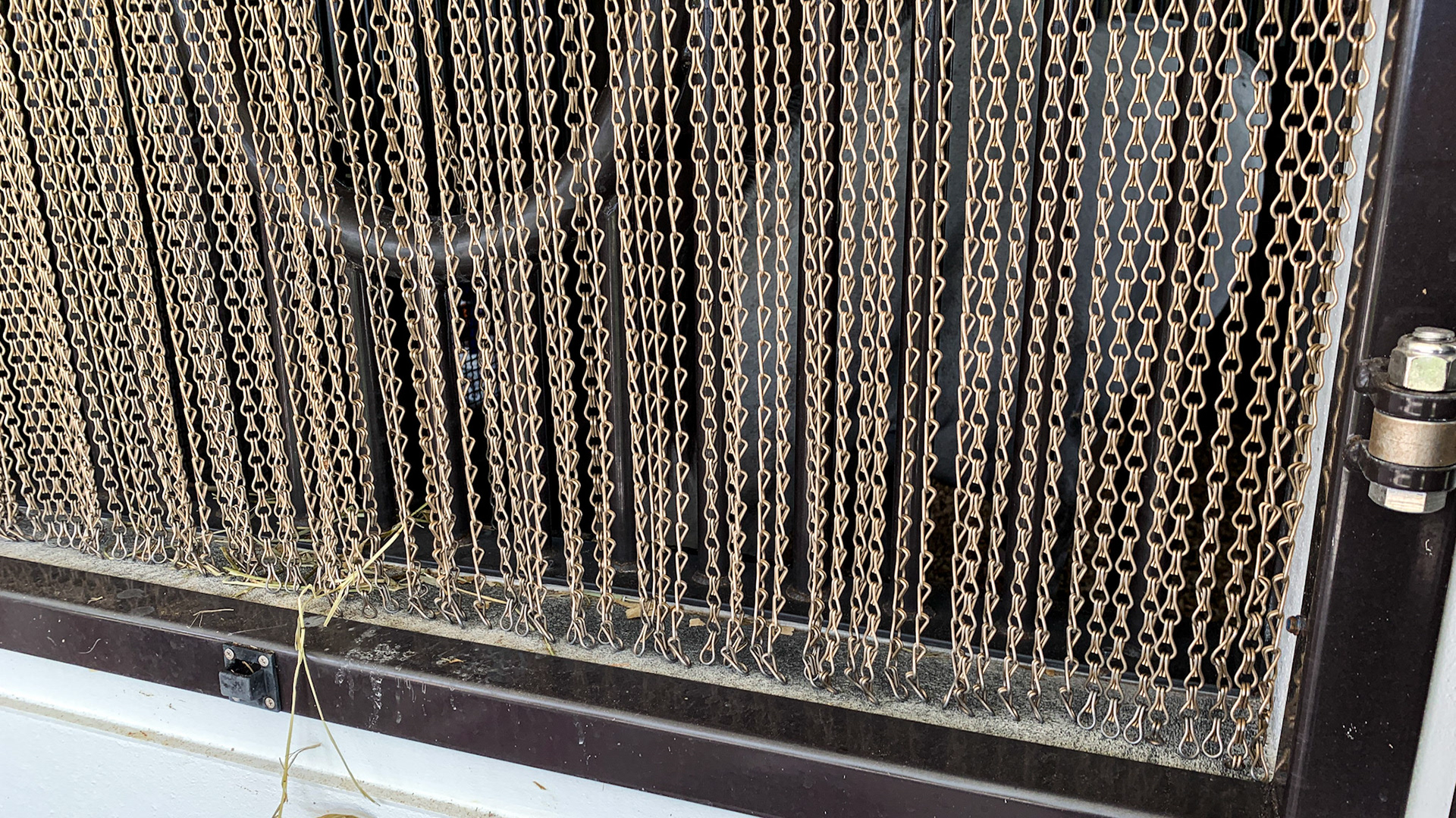 A curtain of chain effectively keeps the flies out of this barn.