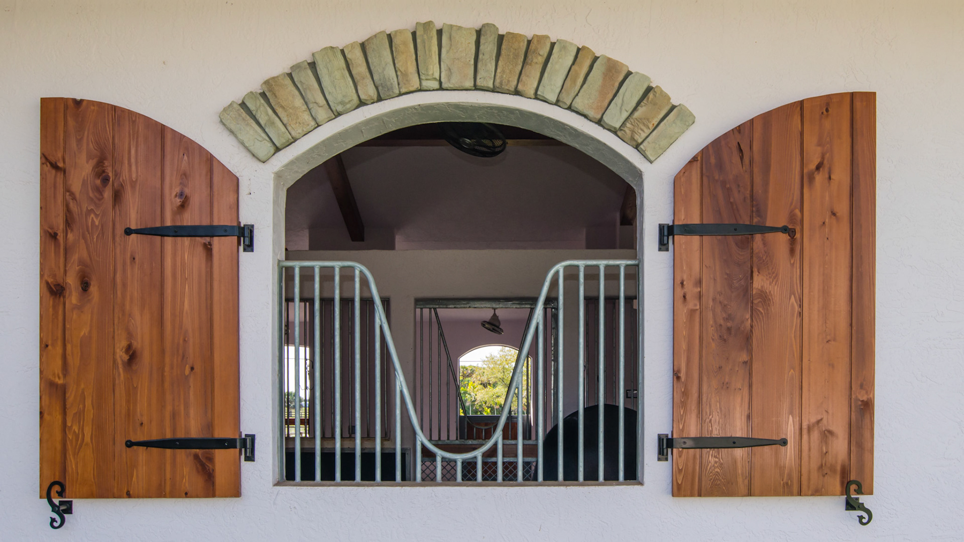 Beautiful decorative stones above the stall window.  The shutters are functional.