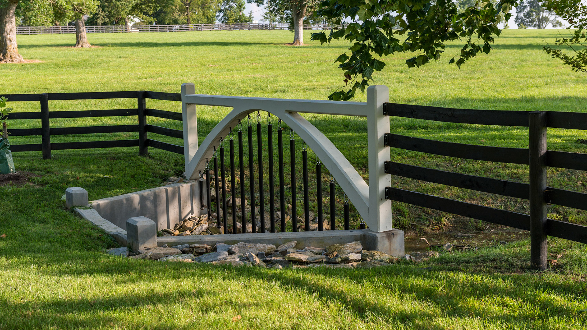 This fence over a stream is effective even when the water becomes high.