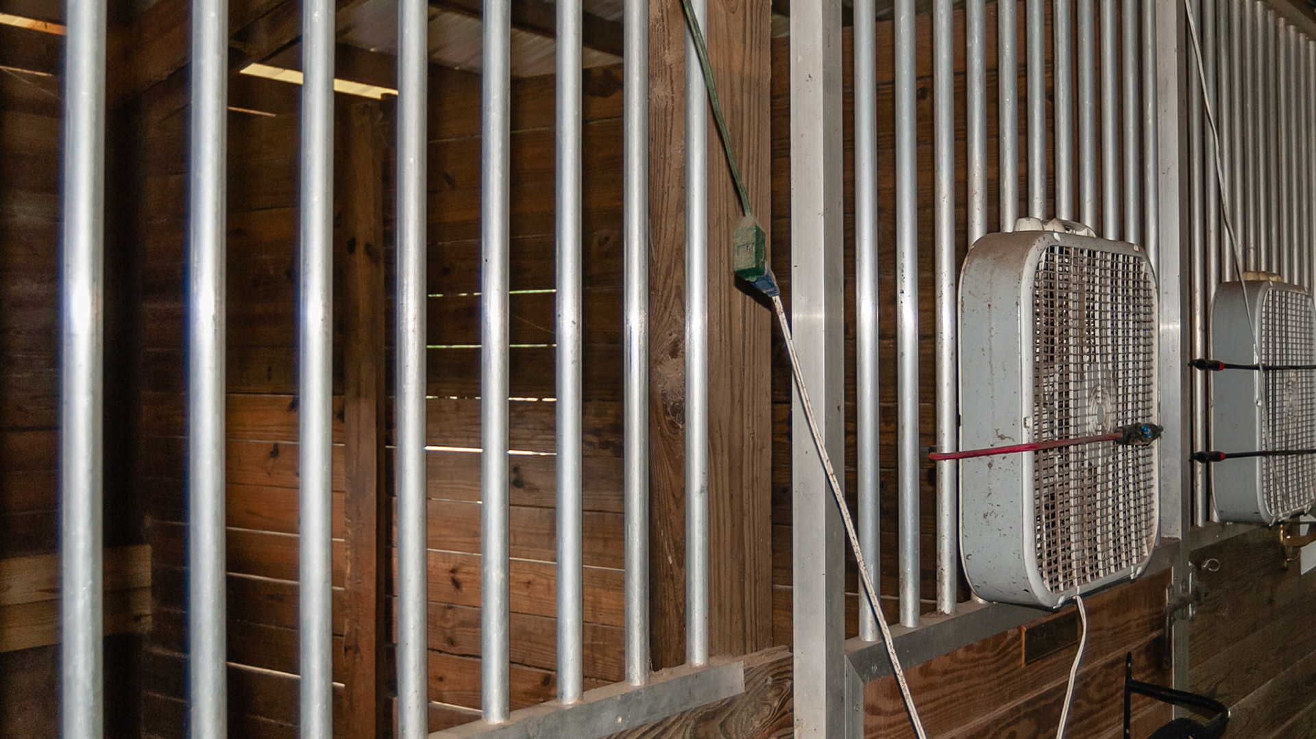 Extension cords add resistance which can build up heat.  In some cases a horse can chew on exposed wires.