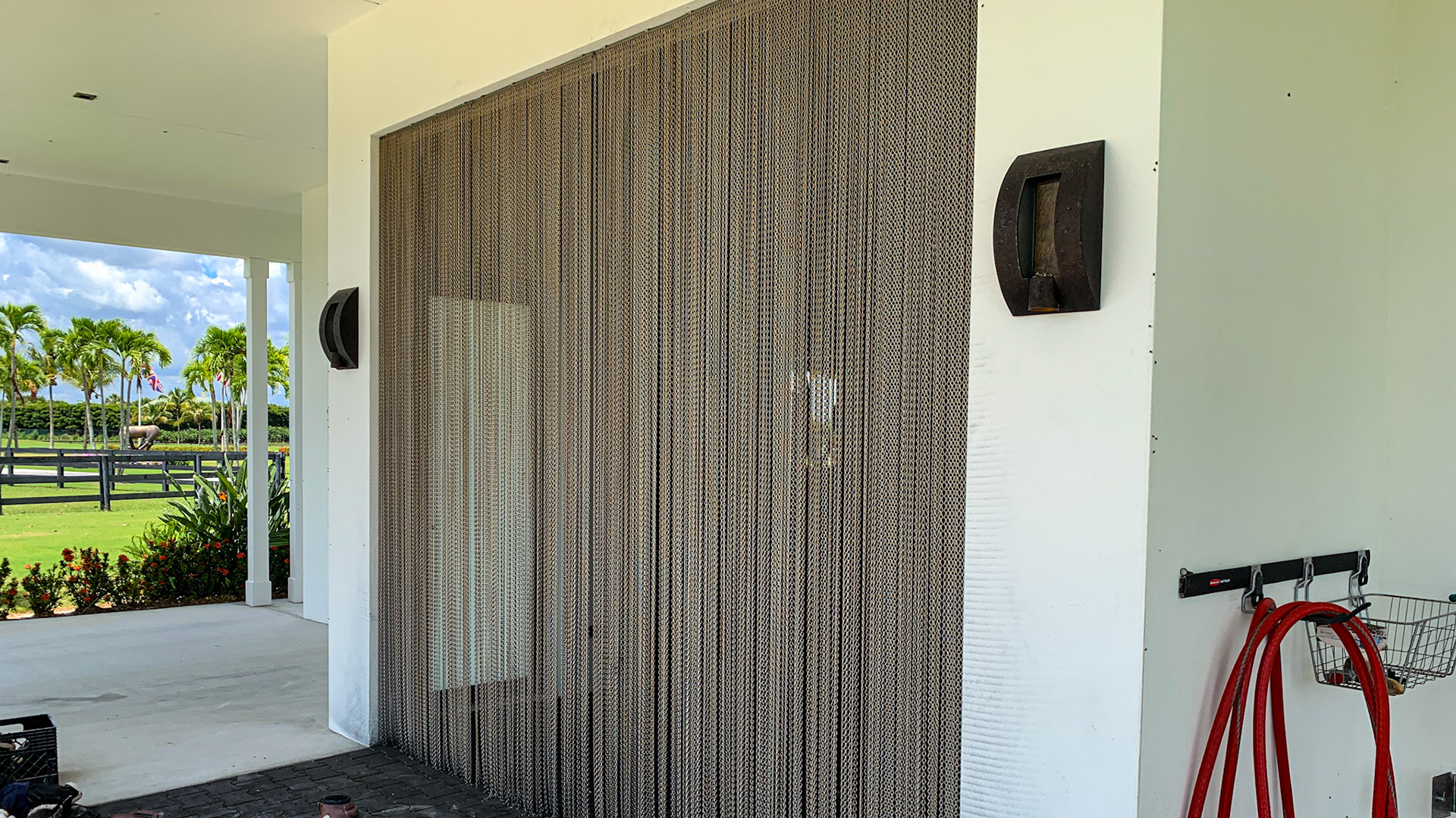 A curtain of chain effectively keeps the flies out of this barn.