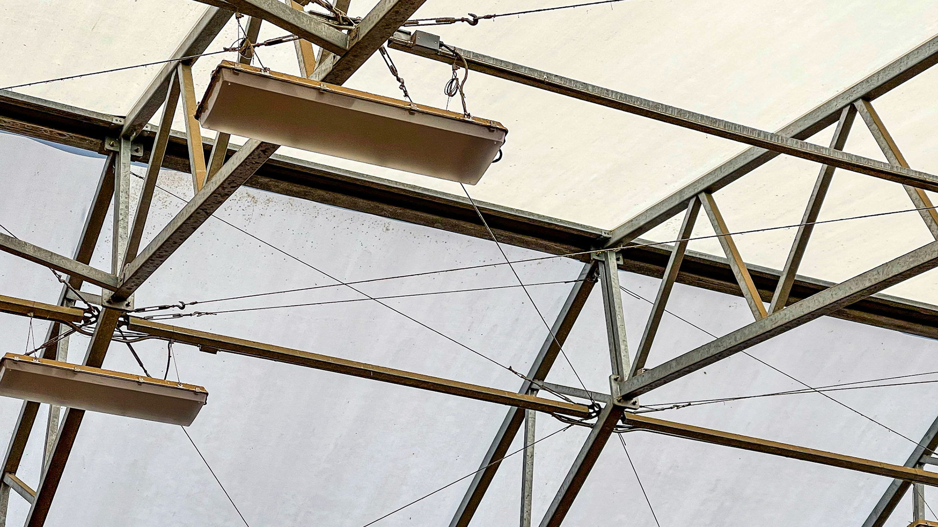A covered arena using a fabric roof. The stalls are also located within this structure, making winter work more pleasant in central New York.