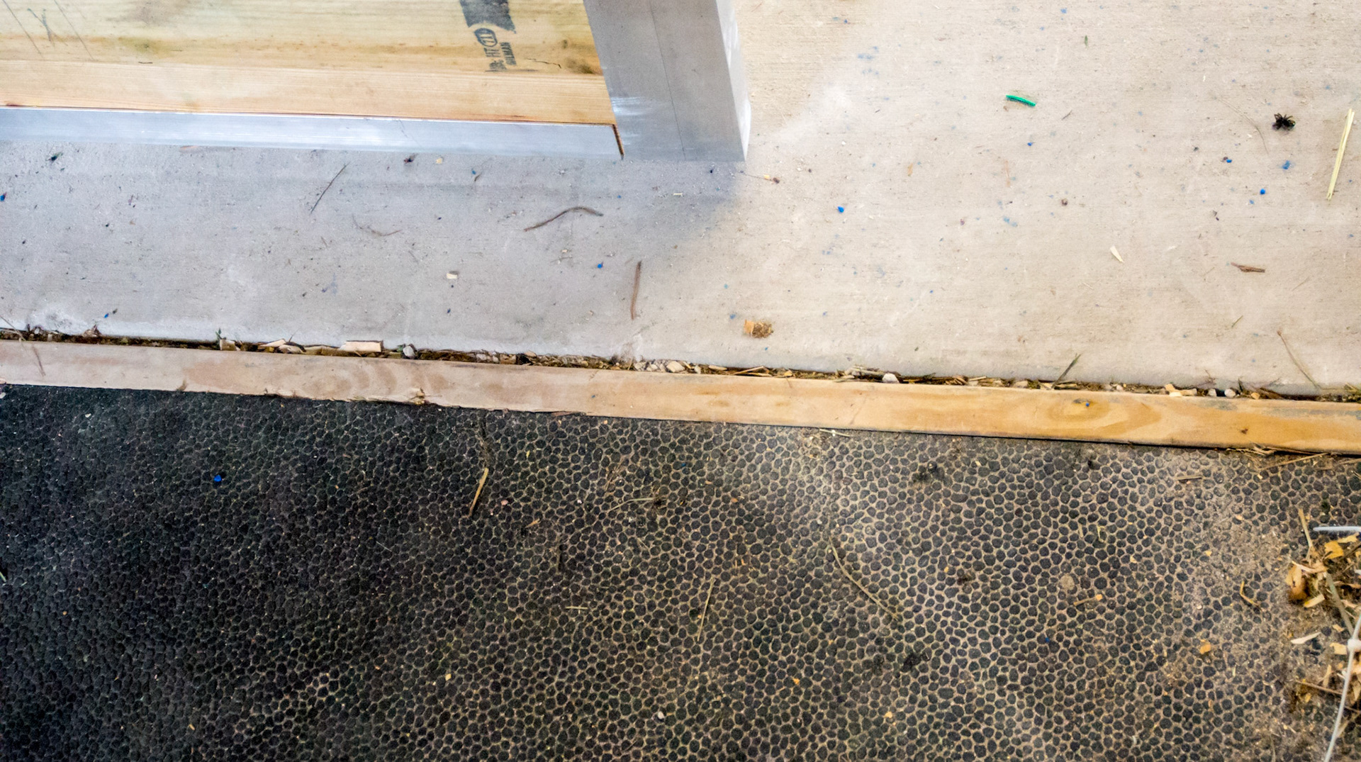 Metal trim in a brand new barn in Loxahatchee, FL - poured concrete and inlaid rubber stall mats