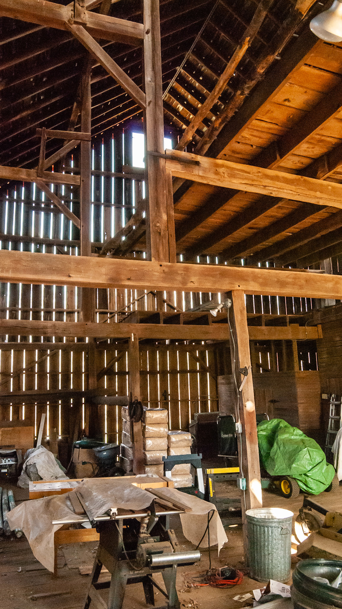 Slatted sides adds ventilation in this converted VA tobacco barn.  Storage for equipment and bedding. Horses are below.