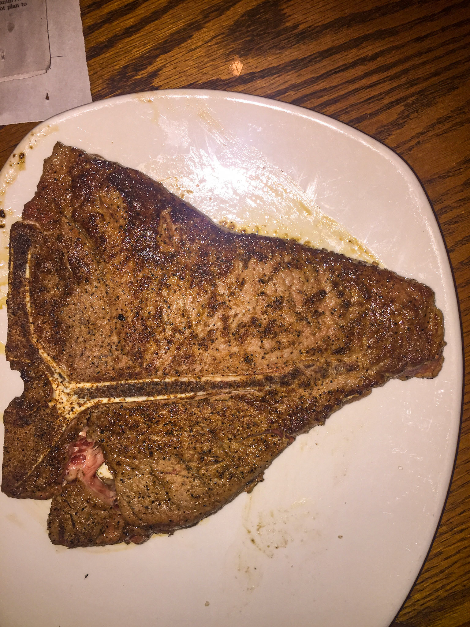 A T-bone steal. On the left is the vertical cut into the vertebra bone and making the “T” going to the right from there is the transverse process bone.  Above this transverse process bone is the sirloin or where your saddle rests.  Below this bone is the filet mignon.  Notice the amount of fat in the sirloin. This comes from eating excess calories and while making the steak taste good, it does not ad strength.  Only by consuming protein will this muscle become stronger.