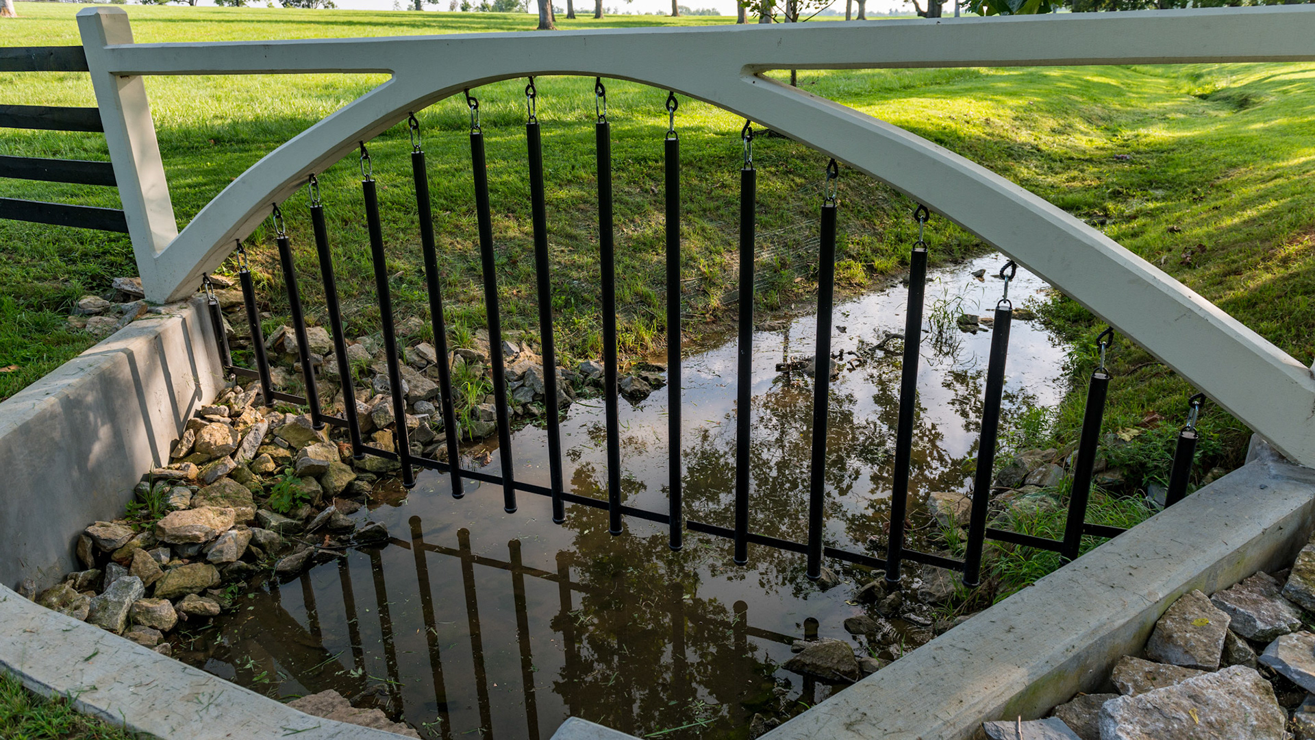 This fence over a stream is effective even when the water becomes high.