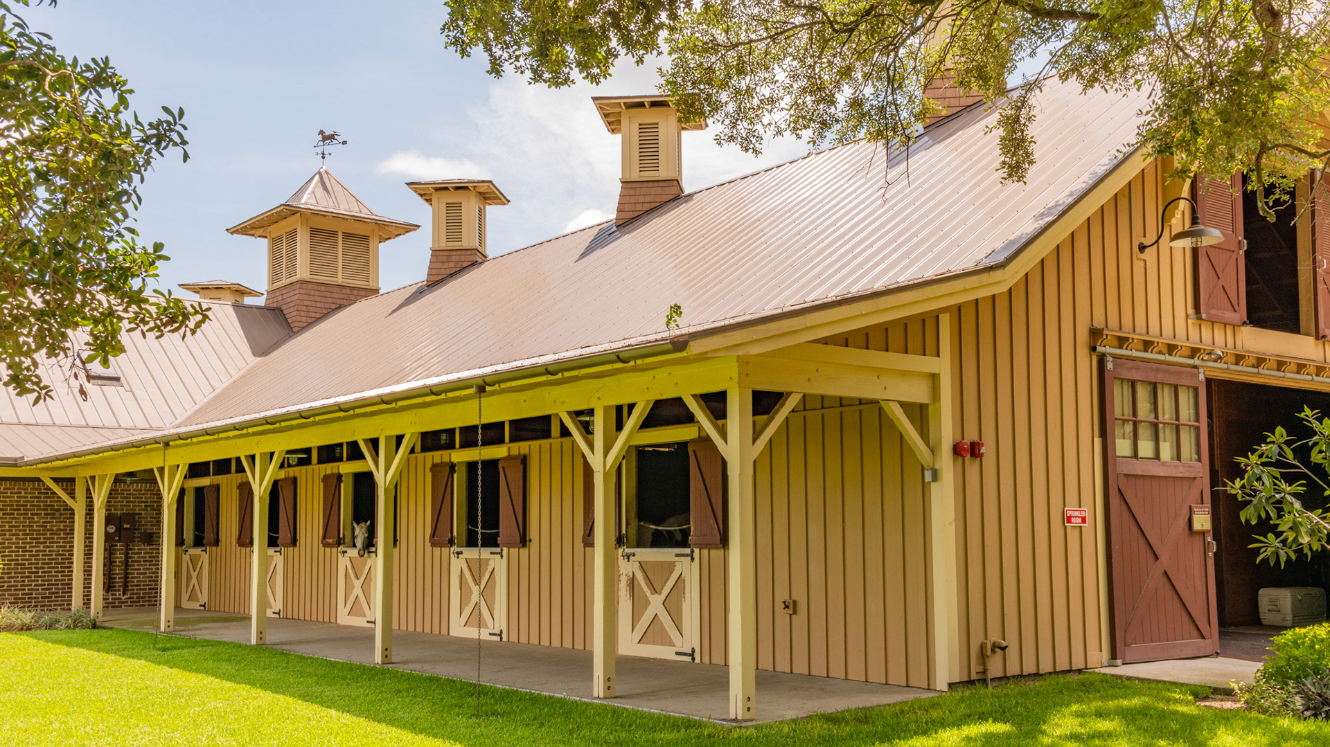 Exterior stall doors, chains for eves trough downspouts, functional cupolas for ventilation, fire alarm system