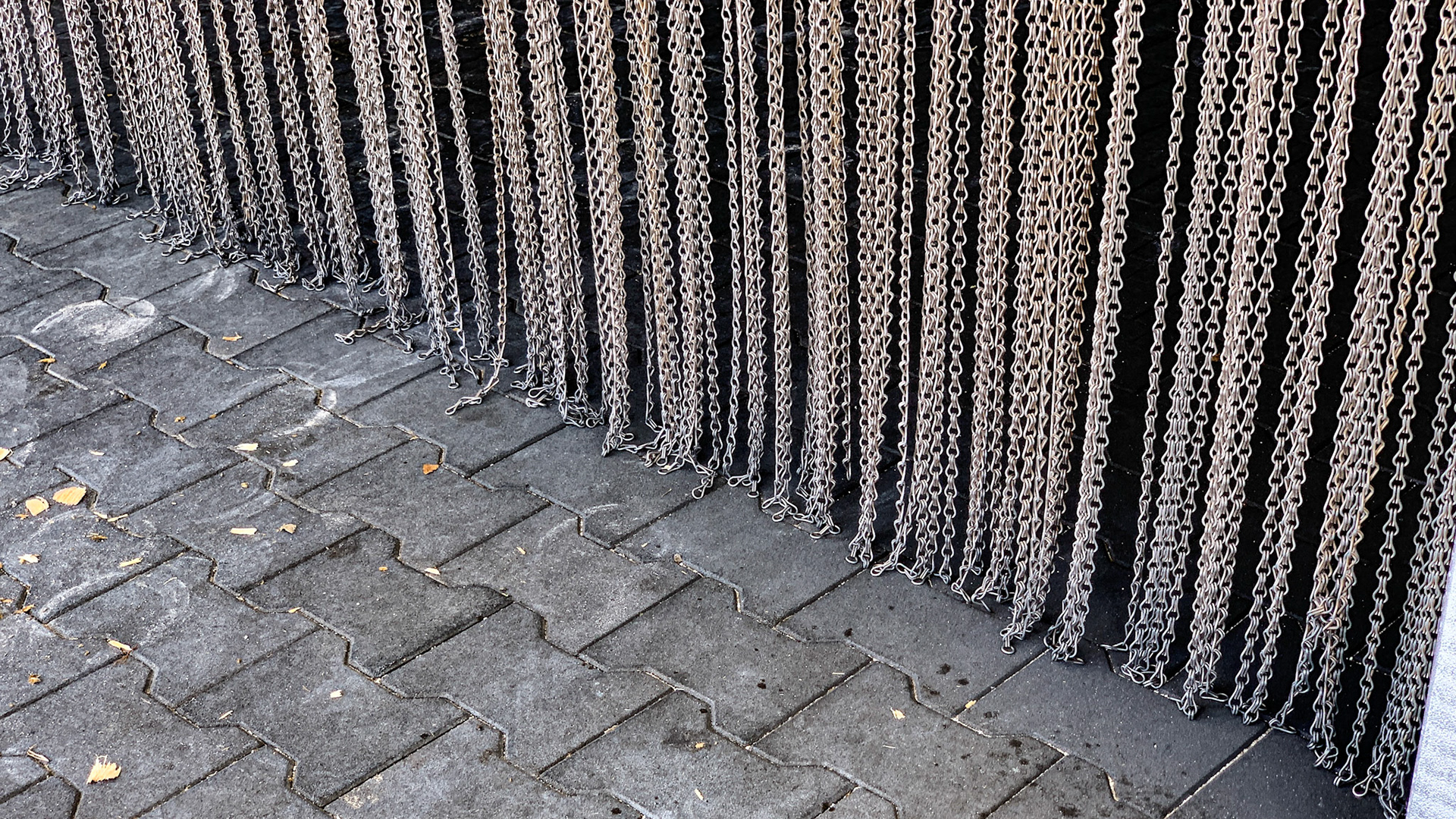 A curtain of chain effectively keeps the flies out of this barn.