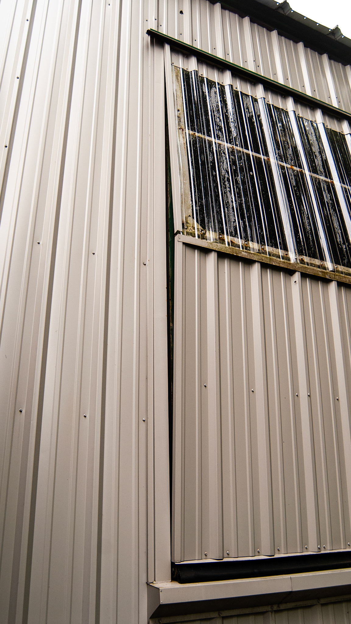 Bifolding doors open in good weather for this indoor arena