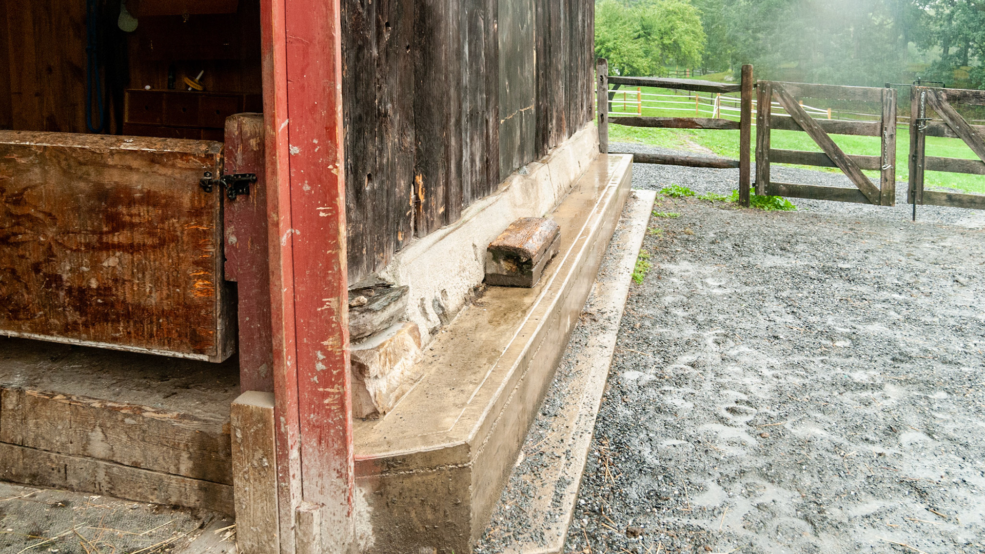 This old barn was built into a hill. Entrance is on the other side where you walk into the third floor. This footer was poured to support the tall side of the barn.