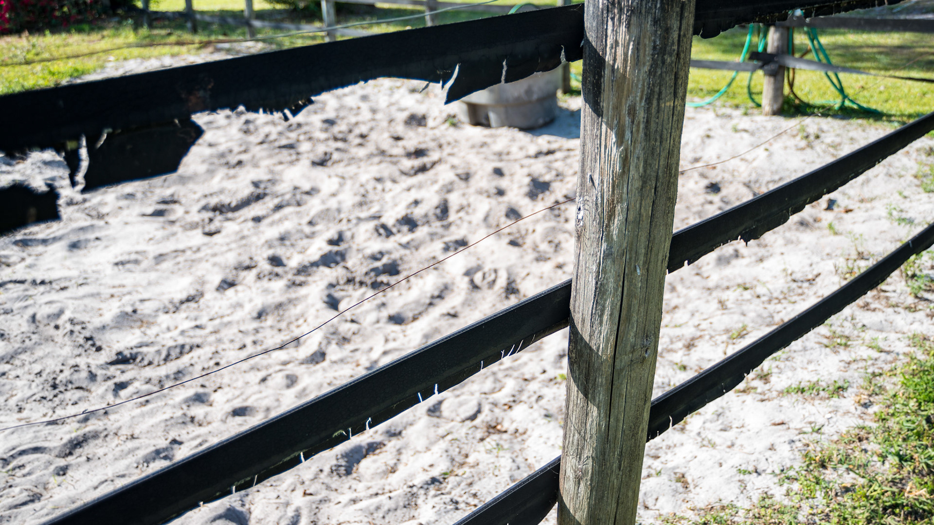 Rubber fencing with exposed edges, but no nylon threads seen (burned off?). Exposed wire and insulators.