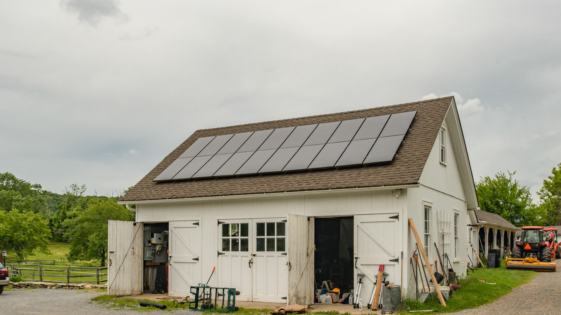 Owner in NY says these solar panels produce more electricity than he uses in summer, but in winter, he spends $15 / mo on electricity.