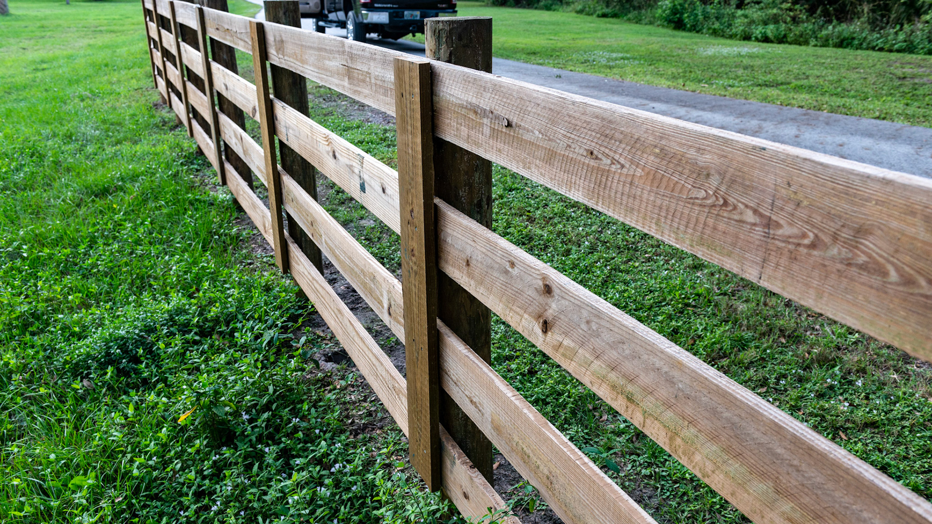 These verticle face boards are unnecessary on the horse side of the fence and might even be considered an edge for an injury to occur.