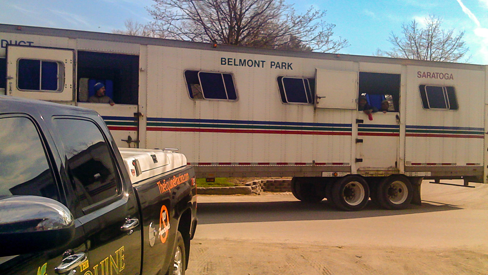 This semi trailer is a taxi for horses traveling between Belmont and Aqueduct race tracks in NY.  The grooms ride in the back with the horses - a tradition since they started shipping horses. The wheels are small to allow more space inside for the horses.