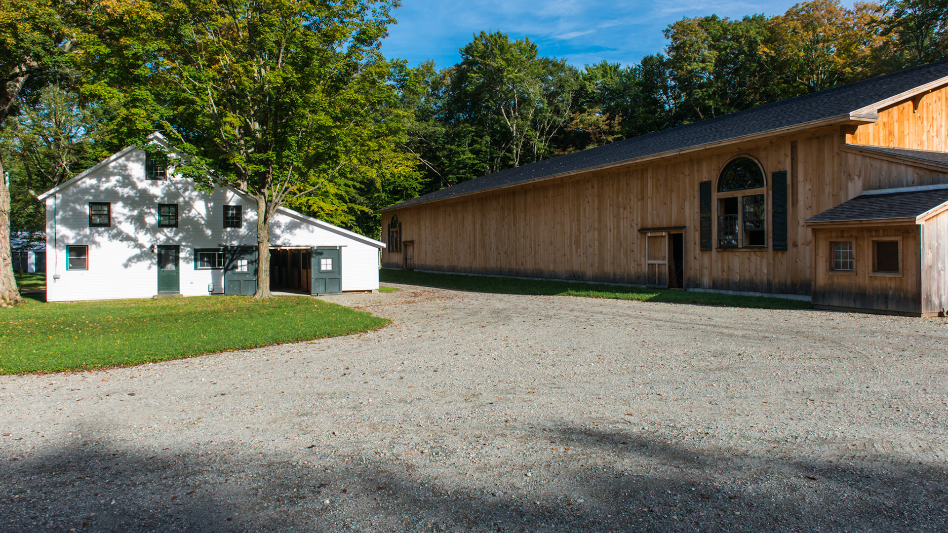 A refurbished barn and a covered arena next door