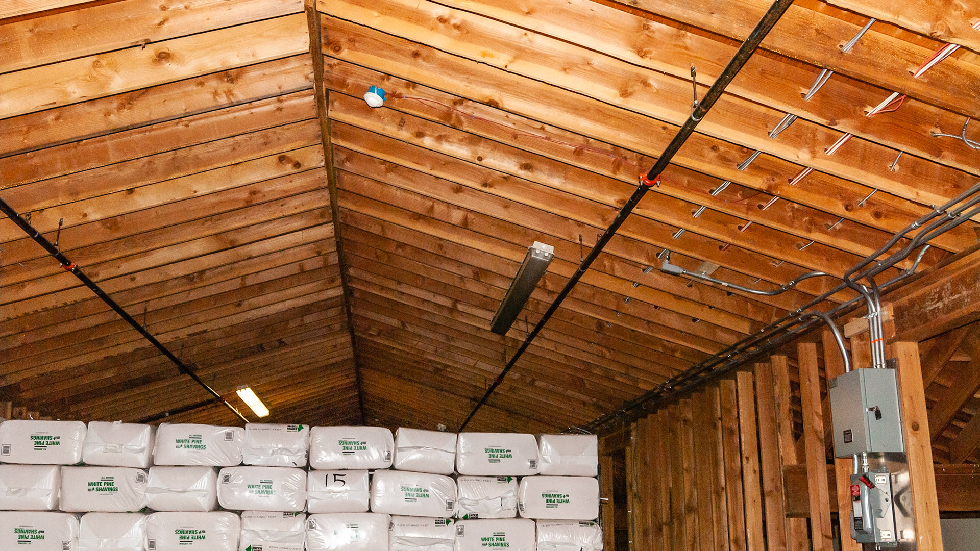 The proper installation of electricituy in a barn.  Fire detectors and a sprinkler system installed for fire prevention