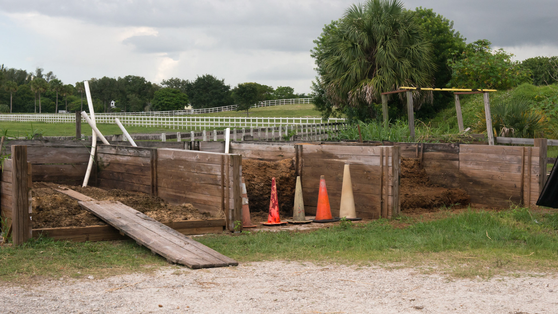 3 bins for manure composting. Air tubes plus daily watering and turning the top layers. 2 months later it is spread on an unused paddock and allowed to set for 1 month. 1 of 4