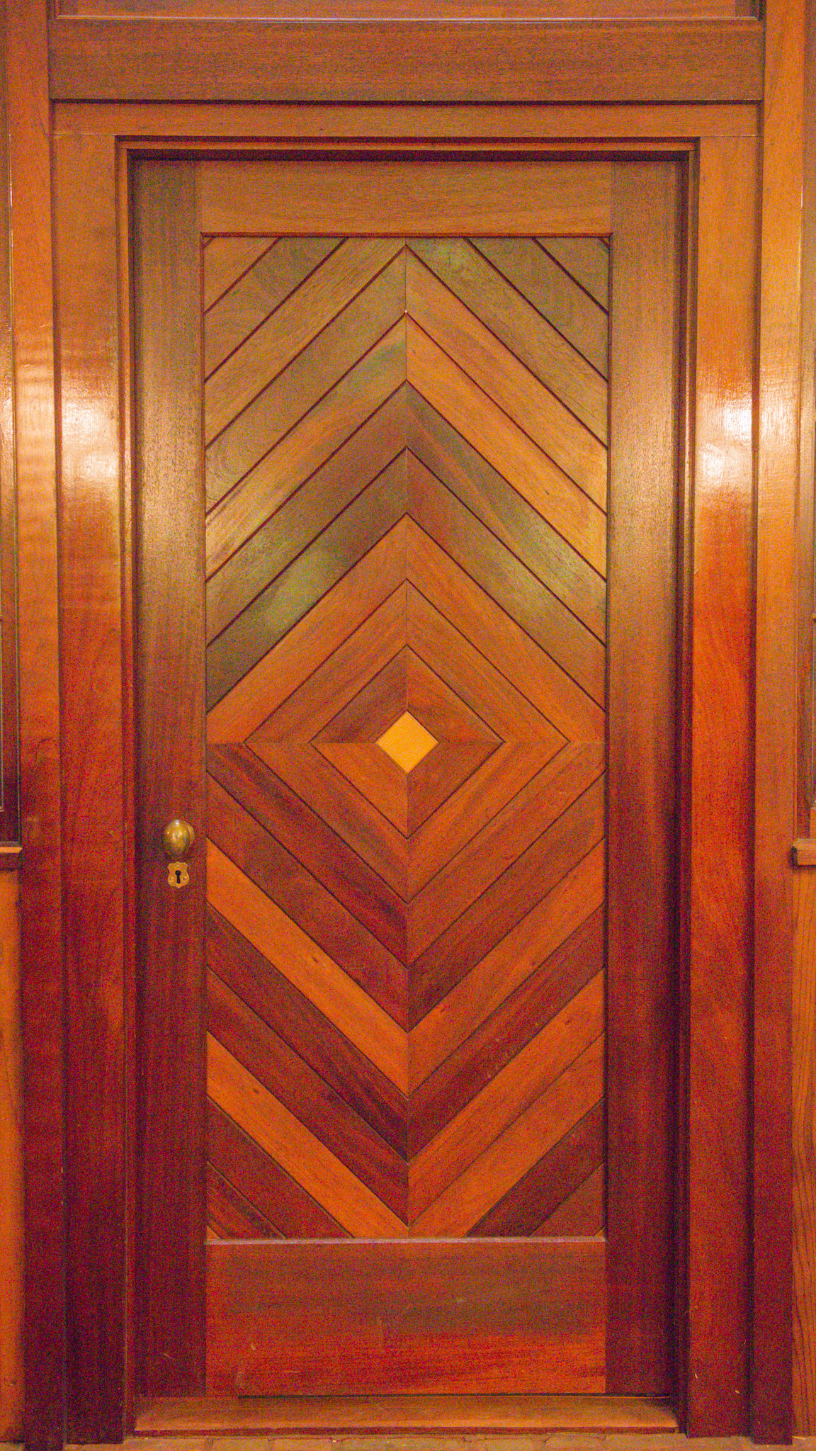 A custom made hardwood door inside the barn.  Every human door was made this way.
