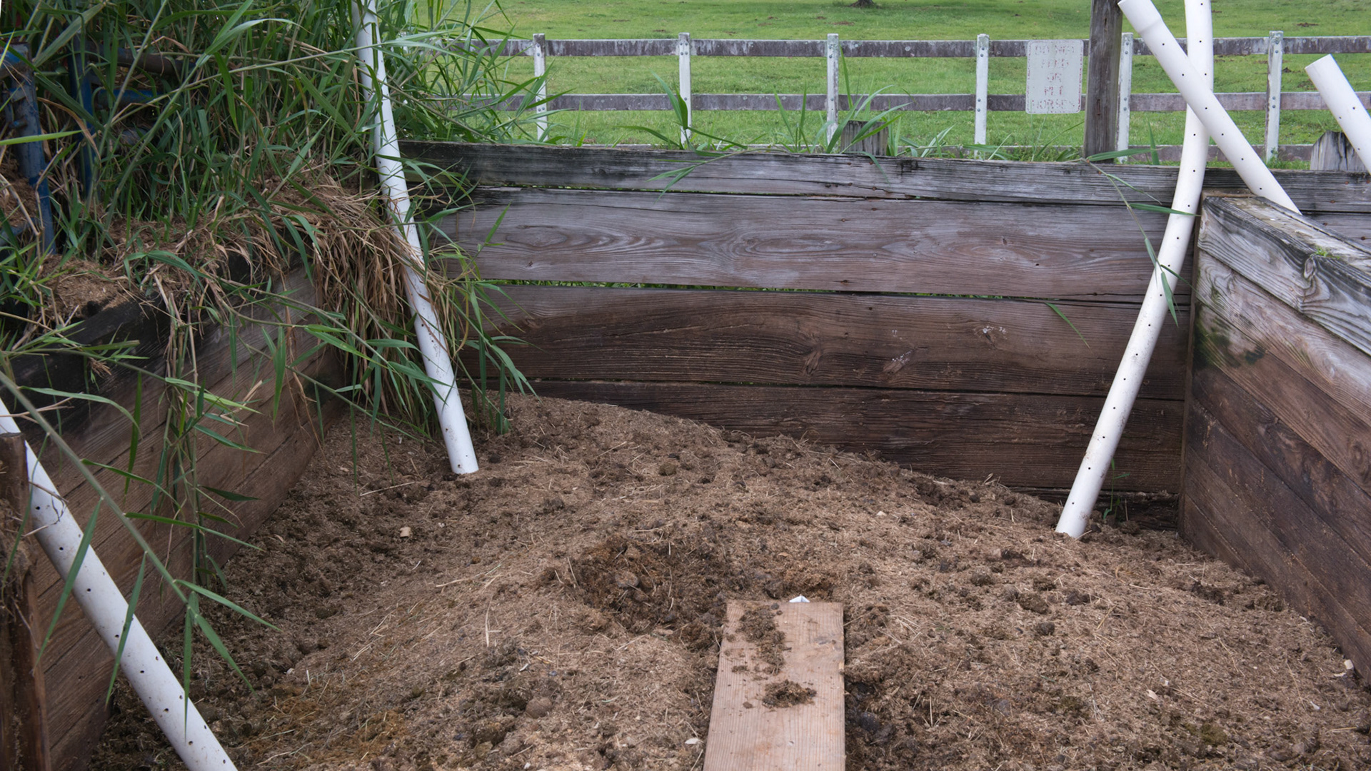 3 bins for manure composting. Air tubes plus daily watering and turning the top layers. 2 months later it is spread on a unused paddock and allowed to set for 1 month. 2 of 4