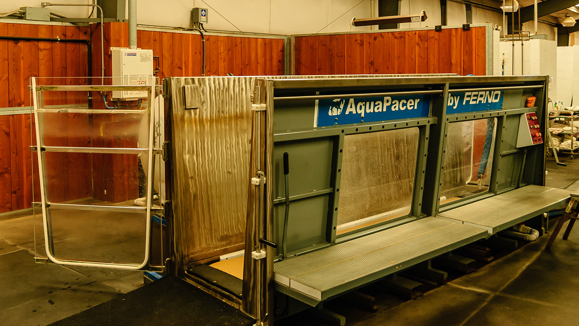 This is an underwater treadmill system.  The horse loads into the waterproof container around the treadmill and it is filled with the treated and clean water from the outside tank.  The water adds resistance to the walking motion.