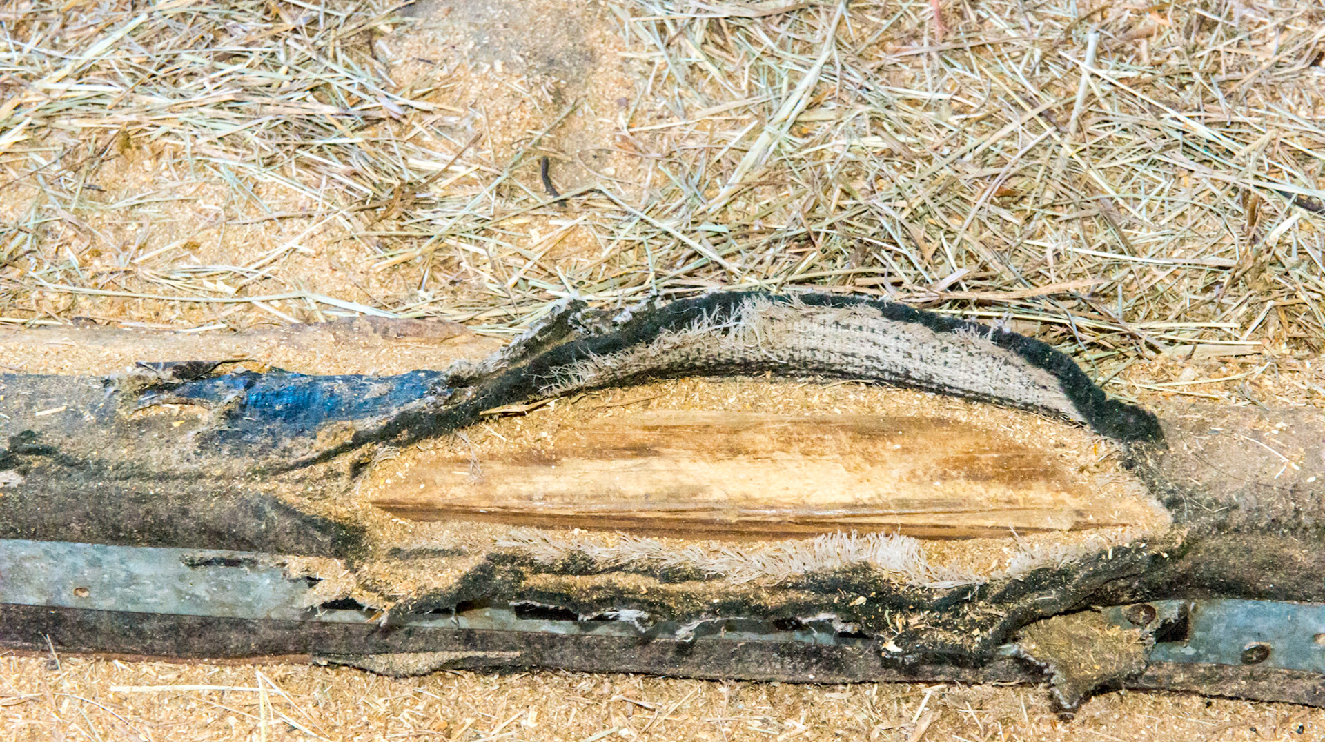 This solid rubberized fabric covers the entire floor of the stall making cleaning easy while not allowing waste to penetrate the ground below. The edges can become worn and fray.